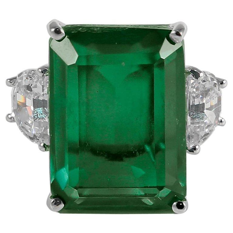 Designer Synthetic 20 Carat Rectangular Step Cut Emerald Diamond Ring In New Condition In New York, NY
