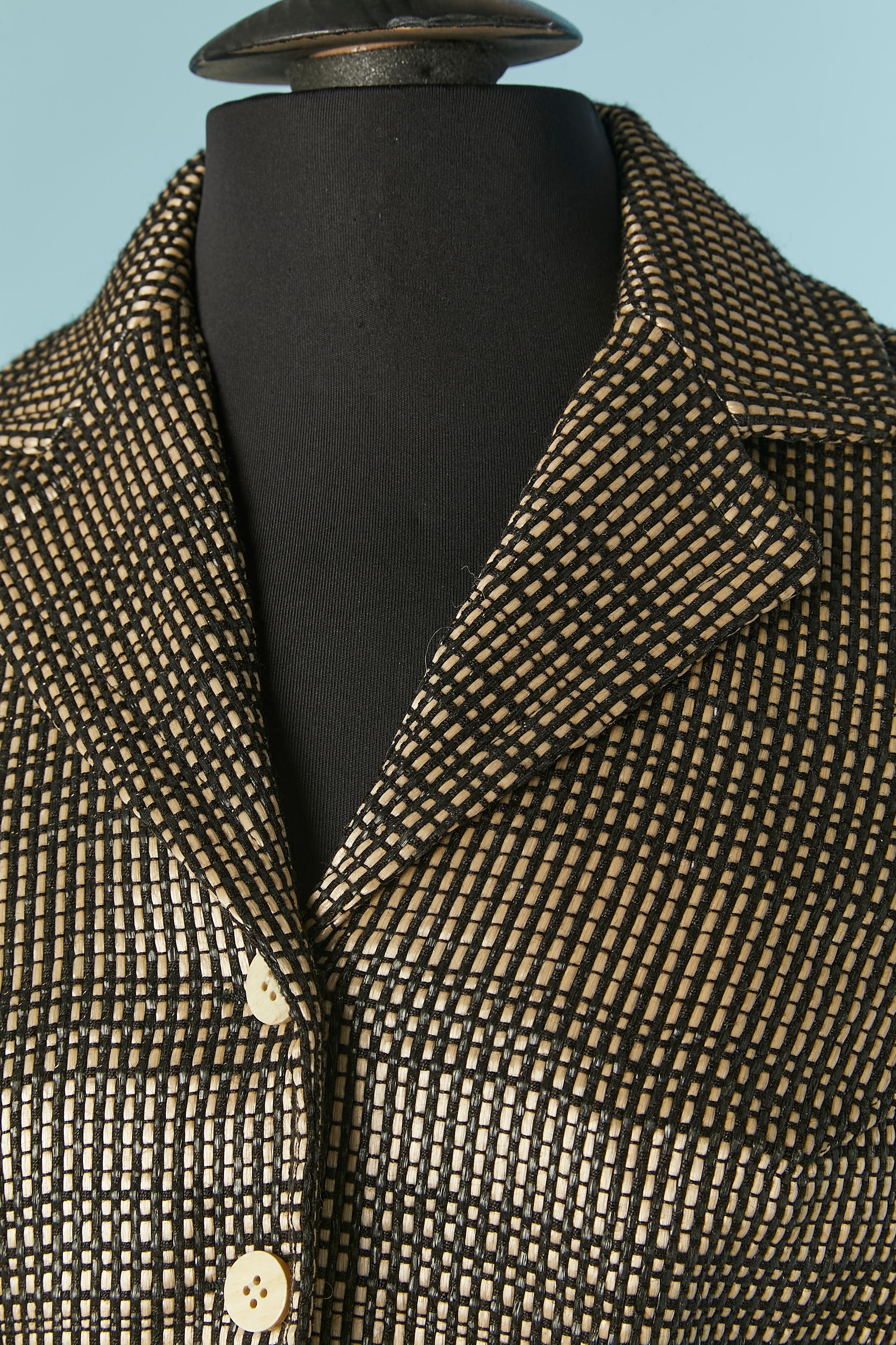 Synthetic off-white and black woven raffia single breasted jacket.
Main fabric composition: 90% polyester, 10% cotton. Nylon tulle lining and piping. Black cotton lining only inside the back of the shoulders. 
Size 8 (Us) but fit more likely S 