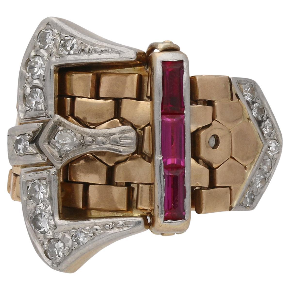 Synthetic ruby and diamond buckle ring, circa 1940. For Sale