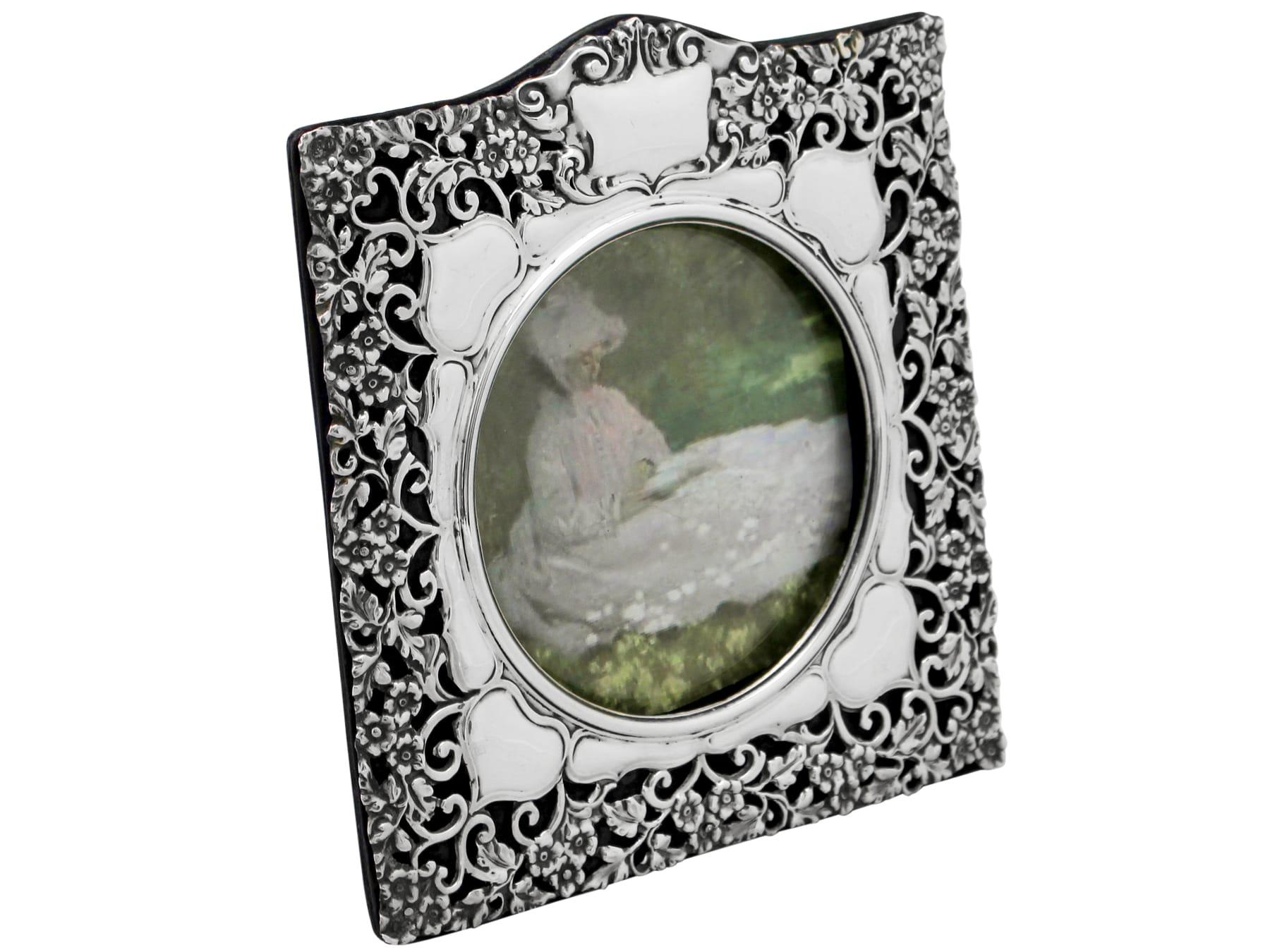 A fine and impressive antique Edwardian English sterling silver photograph frame; an addition to our ornamental silverware collection.

This fine antique Edwardian sterling silver photograph frame has a square form with a domed upper