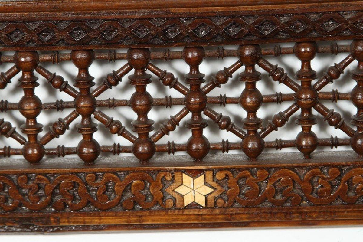 Antique middle Eastern Moorish mirror. Large antique early 20th century Middle Eastern Egyptian arched mirror inlay could be used as a mantel piece. Syrian style inlay over ornate carving, rectangular frame inlaid with geometric design having
