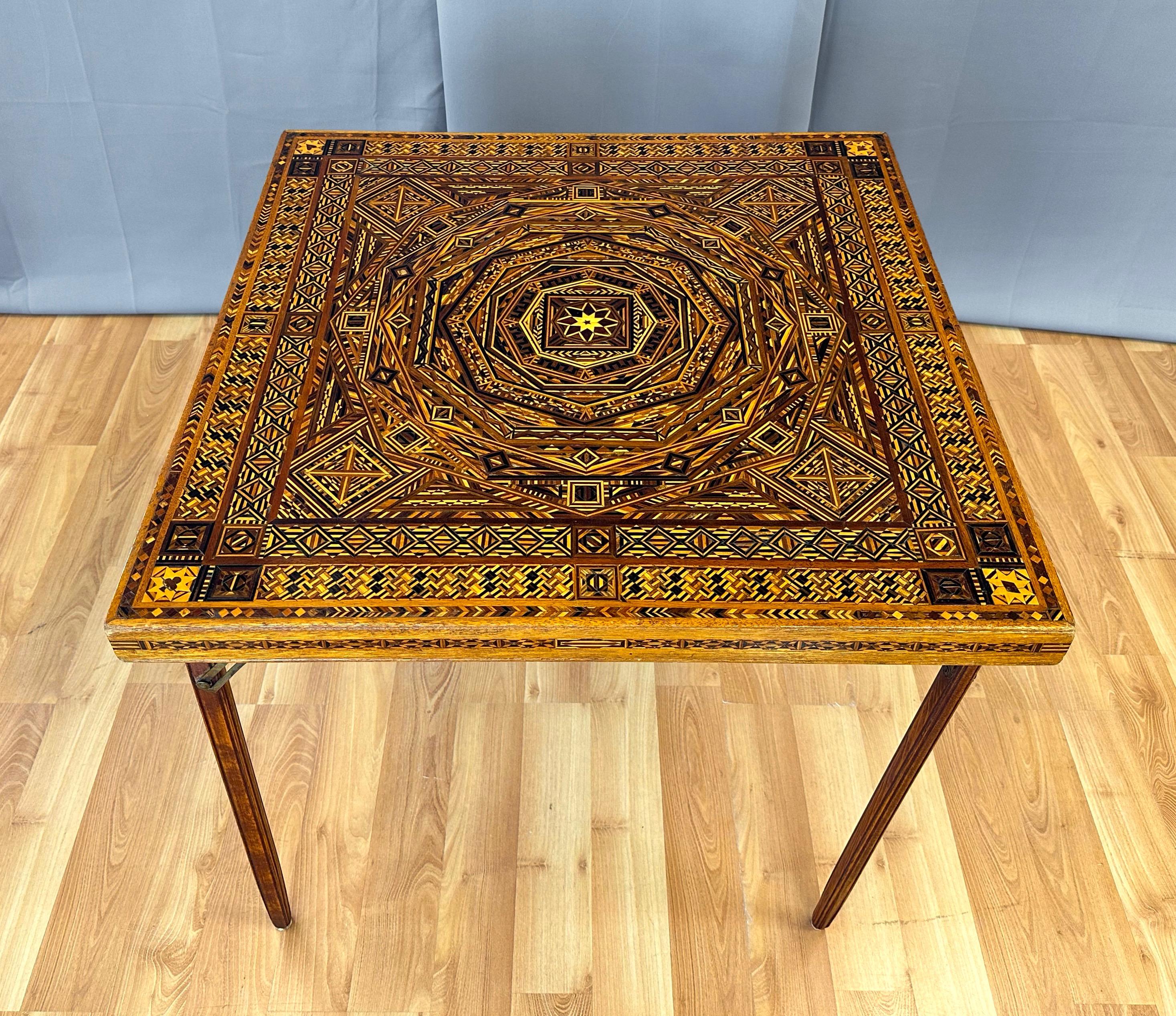 A very uncommon, exceptionally intricate, and visually transfixing 1930s Syrian or Syrian-style wood marquetry folding card table.

Top and sides feature an incredibly complex and very well-executed Damascene or Moorish geometric mosaic design