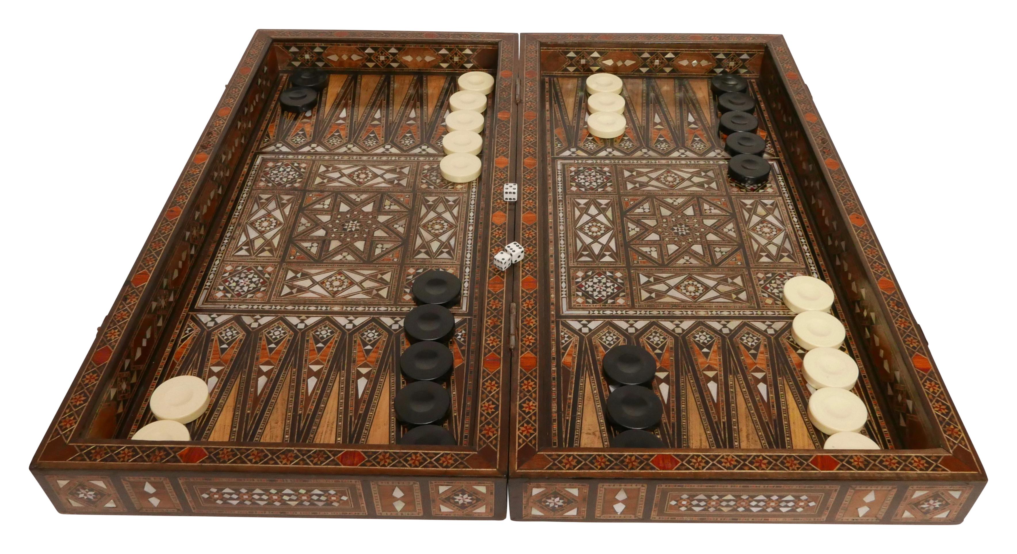 Beautifully handcrafted backgammon and chess game box with intricate marquetry of mixed woods and mother of pearl inlay in a Moorish geometric pattern.
Inlays of olive, rosewood, mahogany, walnut and lemon wood.
When closed the box measures 3.5