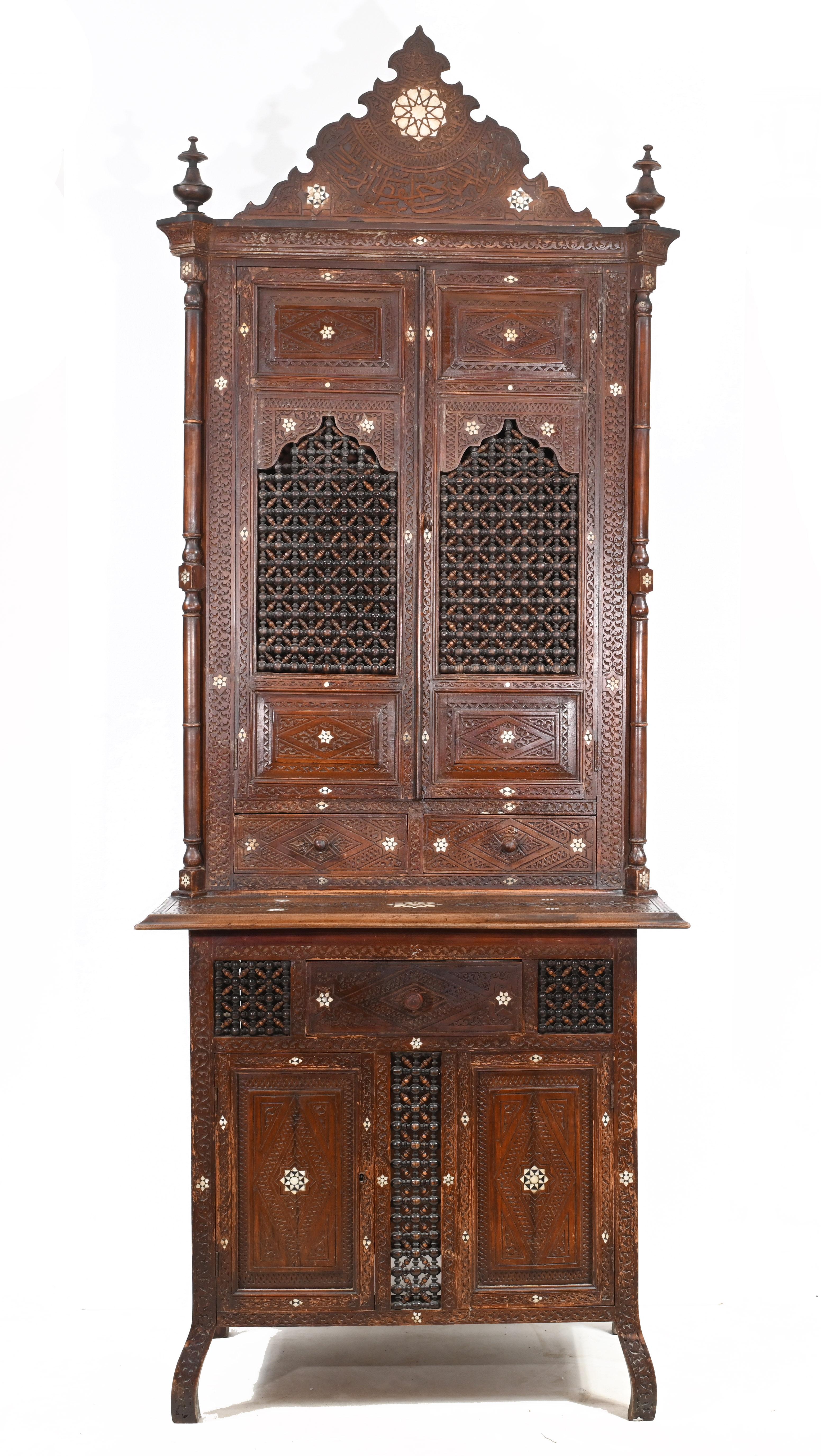 You are viewing a wonderful Syrian antique cabinet or bookcase
Very on trend, the Bohemian chic of Islamic and Middle Eastern furniture is very popular in the interiors world
Wonderful interplay between bone inlay work and hand carved