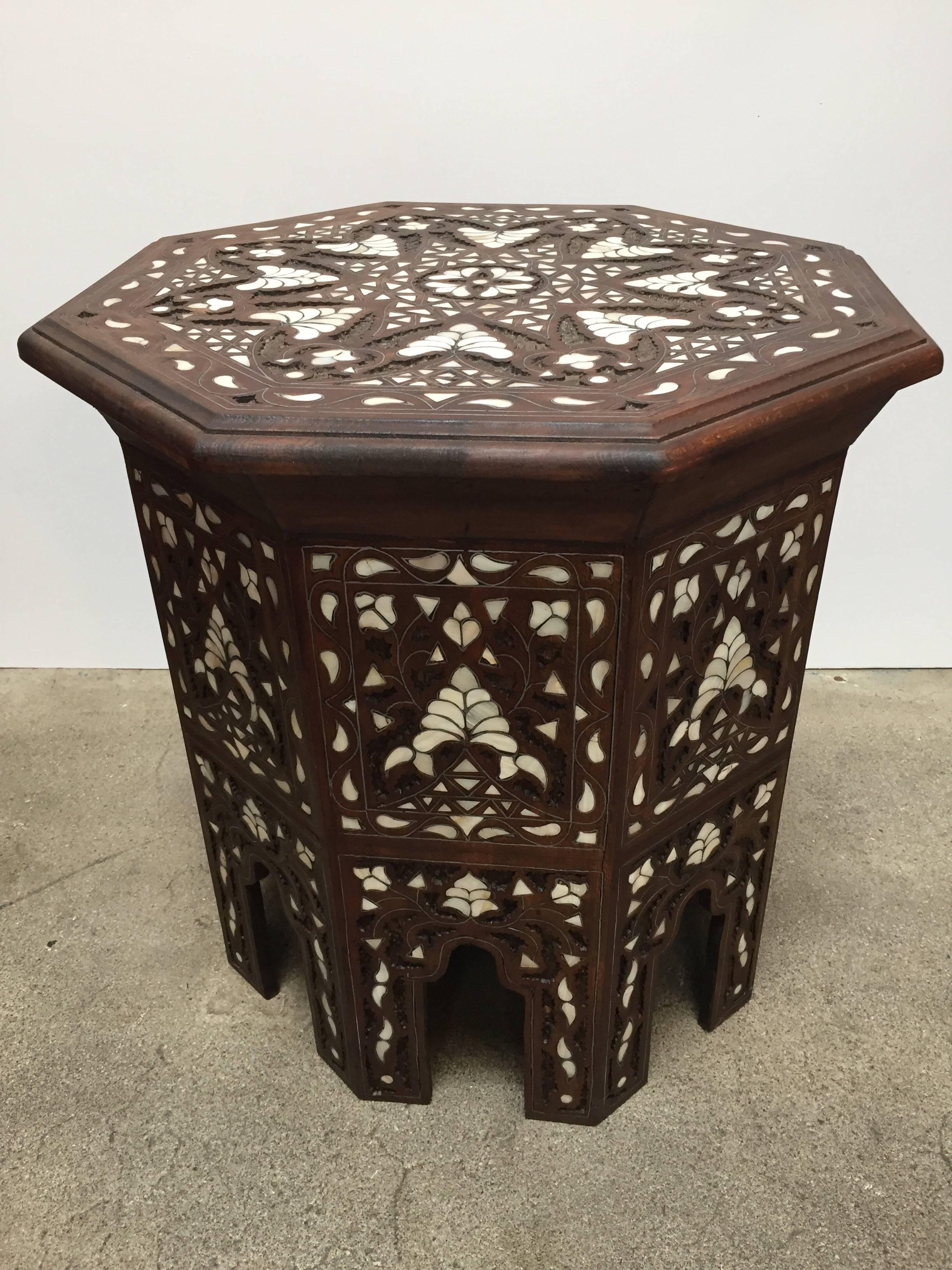Hand-carved walnut octagonal Middle Eastern Syrian mother-of-pearl and silvered metal inlaid side tables.
Nicely decorated with Moroccan Moorish arches and ottoman floral designs.
A pair is available, price is for one.