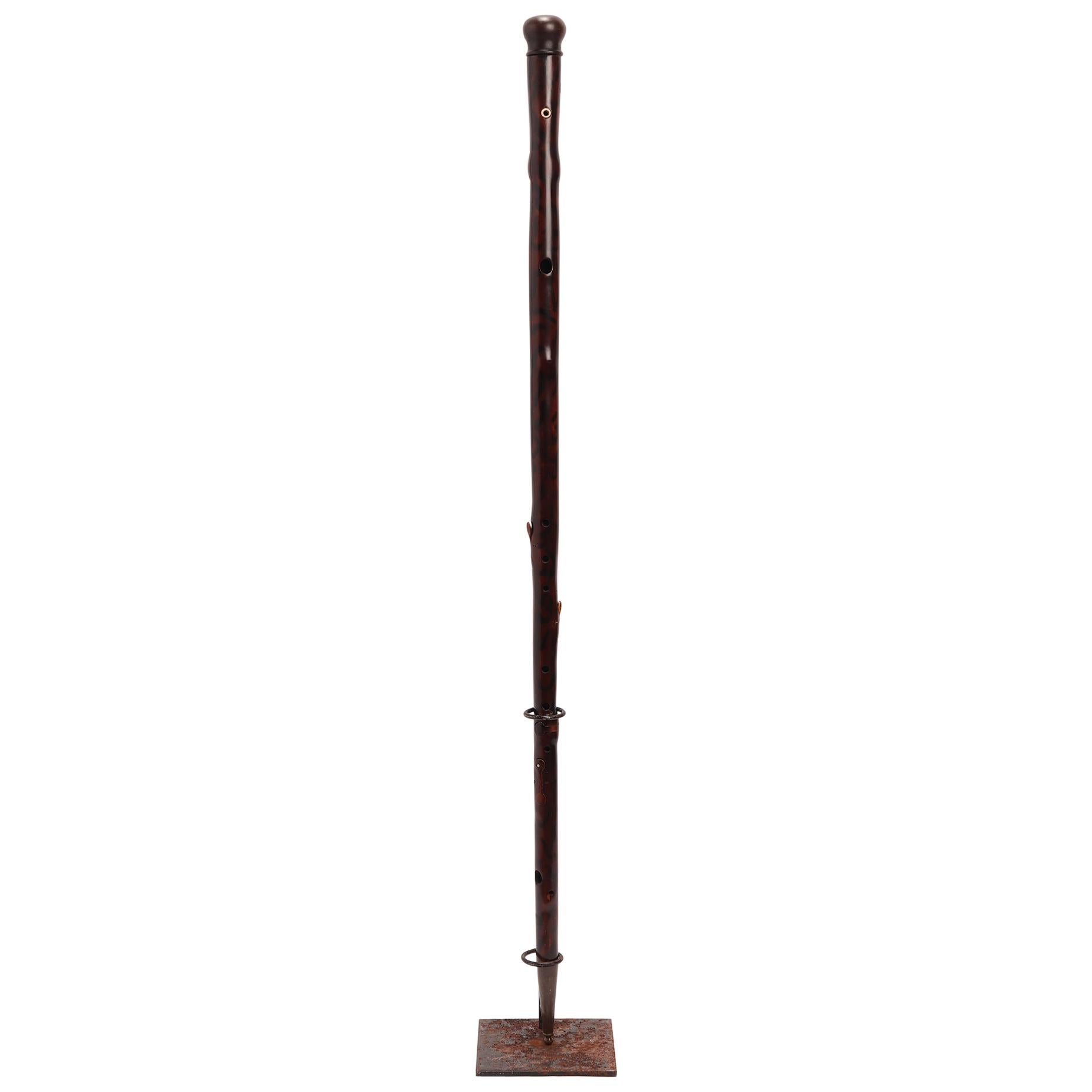 Gadget-system walking stick: stick with the function of a music instrument, a flute. Painted fruitwood shaft, wooden handle. Inside the shaft is hollow, and holes and keys allow to play music once the handle is taken apart. Ferrule made out of brass