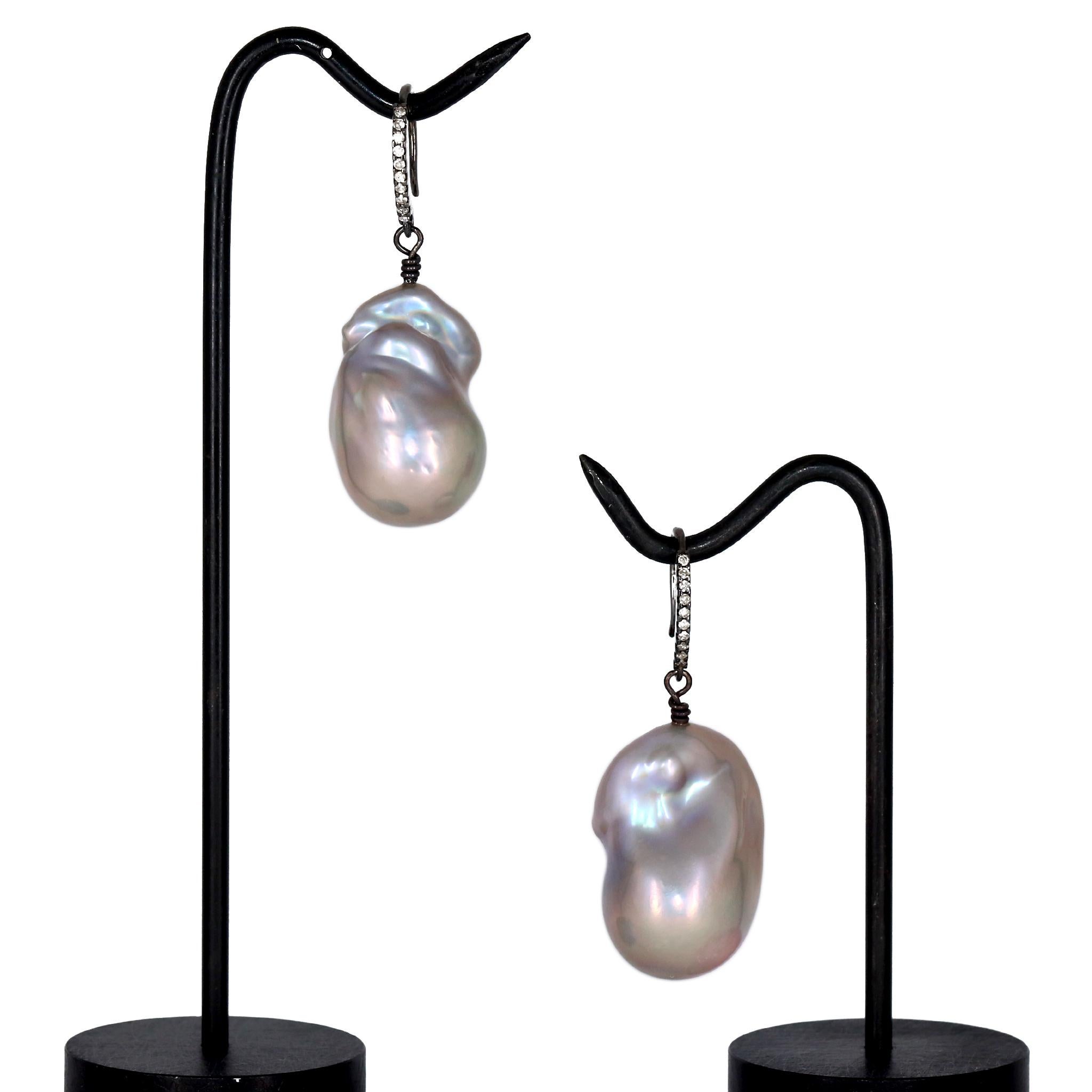 Drop Earrings featuring a matched pair of exquisite iridescent silvery-blue freshwater baroque pearls with violet and pink overtones, attached to diamond-set and black rhodium-finished silver twist ear wires. Pearls measure 28.5mm x 18.5mm and 27mm