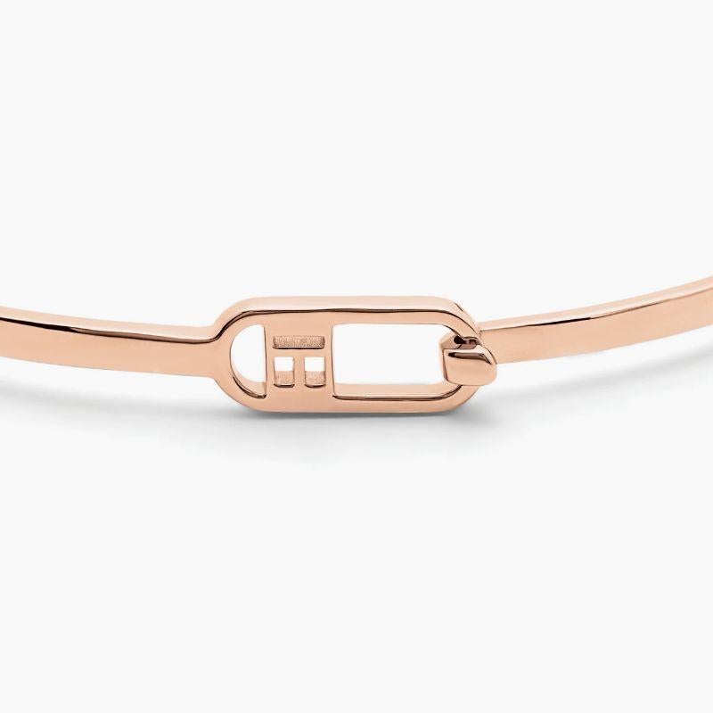 T-Bangle in Polished 18K Rose Gold, Size L

The ultra-thin, highly-polished bangle is perfect for those with a minimalistic style, made to stack with any bracelet or watch. Featuring a simple hook and loop closure with Tateossian-logo detailing.