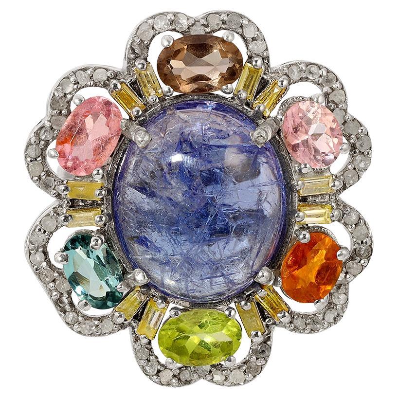 T Bloom Diamond Sapphire Cocktail Ring featuring Sapphires in a multitude of pale hues of pink, lilac, taupe and ice blue accented with diamond set petal edges in a blackened silver and gold cocktail ring.

- Natural Sapphires weight approx 4.3