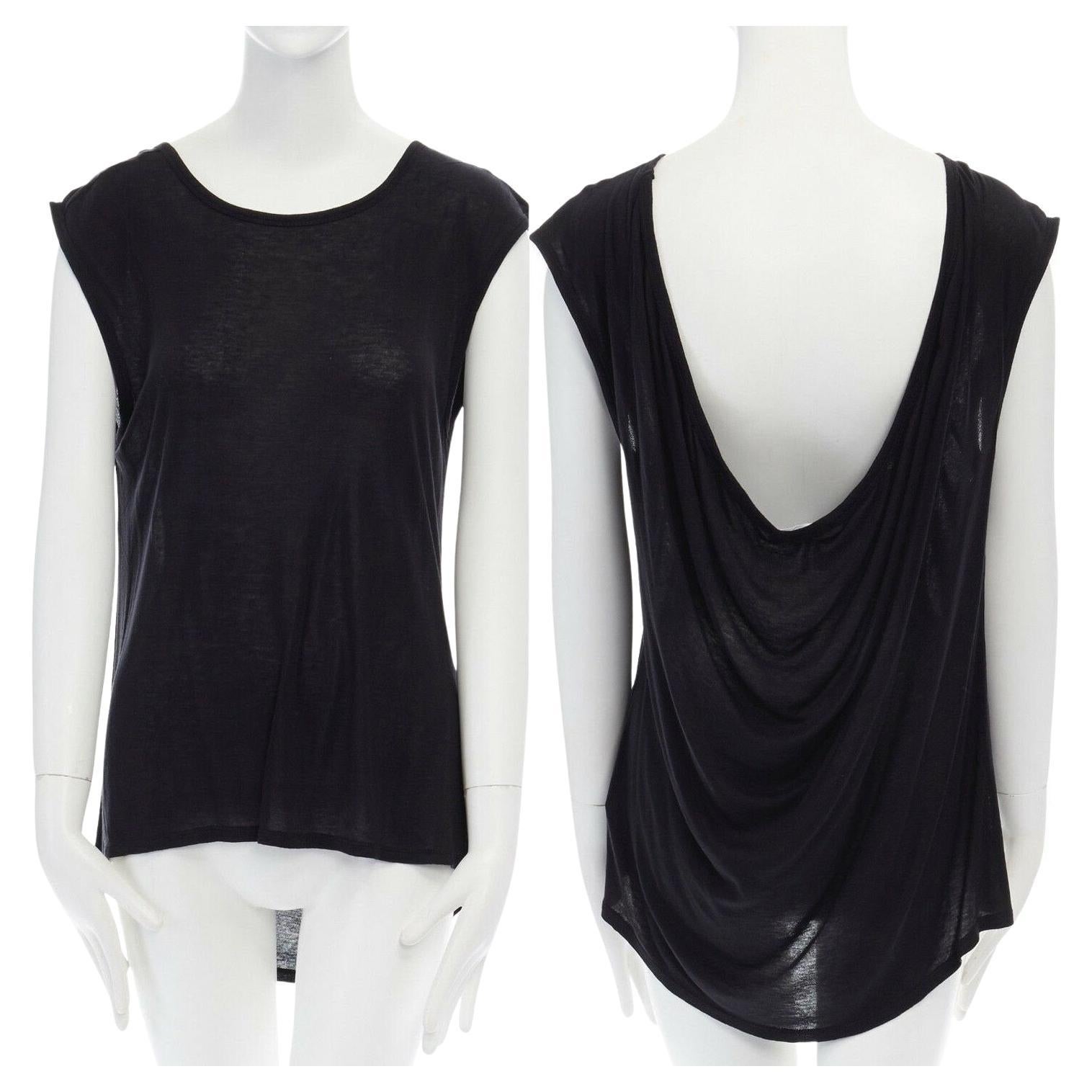 T BY ALEXANDER WANG black Tencel draped back sleeveless tank top XS 
Reference: LNKO/A00887 
Brand: Alexander Wang 
Designer: Alexander Wang 
Material: Tencel 
Color: Black 
Pattern: Solid 
Extra Detail: 100% Tencel. Black. Wide neckline.