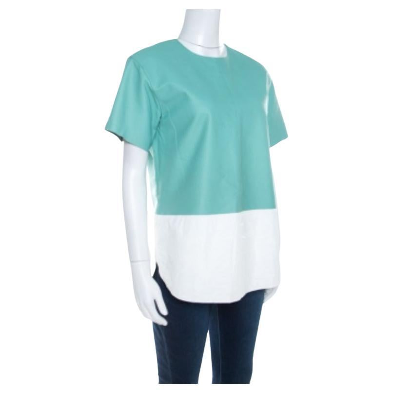 Der erfrischende Colorblcok-Stil in der Kombination von Grün- und Weißtönen verleiht diesem Oberteil von T By Alexander Wang einen lustigen Reiz. Es ist mit einem Rundhalsausschnitt und kurzen Ärmeln ausgestattet. Peppen Sie Ihren Freizeitlook mit