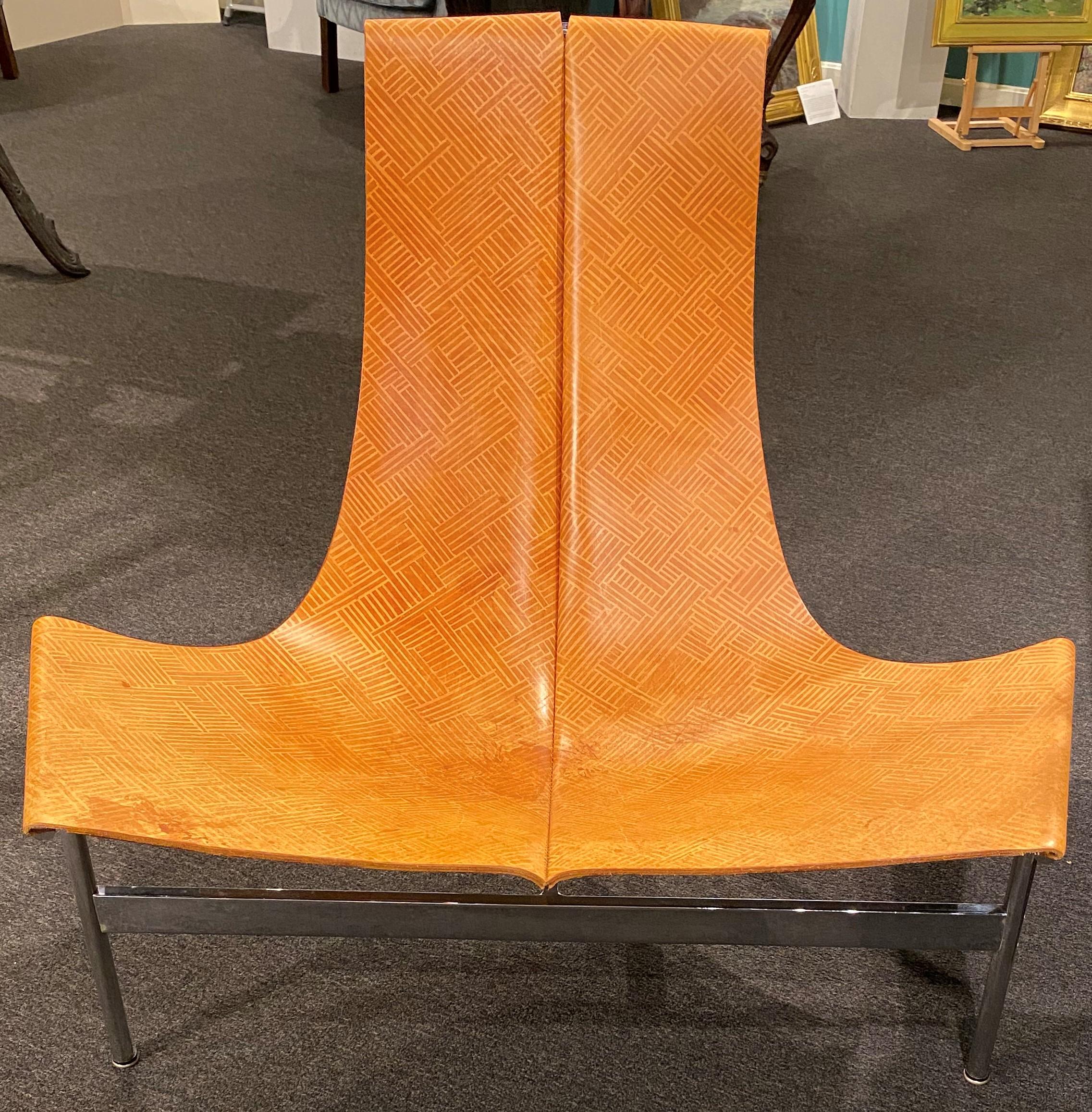 A fine sling back T-chair originally designed by William Katavolos in partnership with Douglas Kelley & Ross Littell in 1952, with custom leather by AVO in Brooklyn, NY,  on a chrome T-form frame. Very good overall condition, with minor scratches