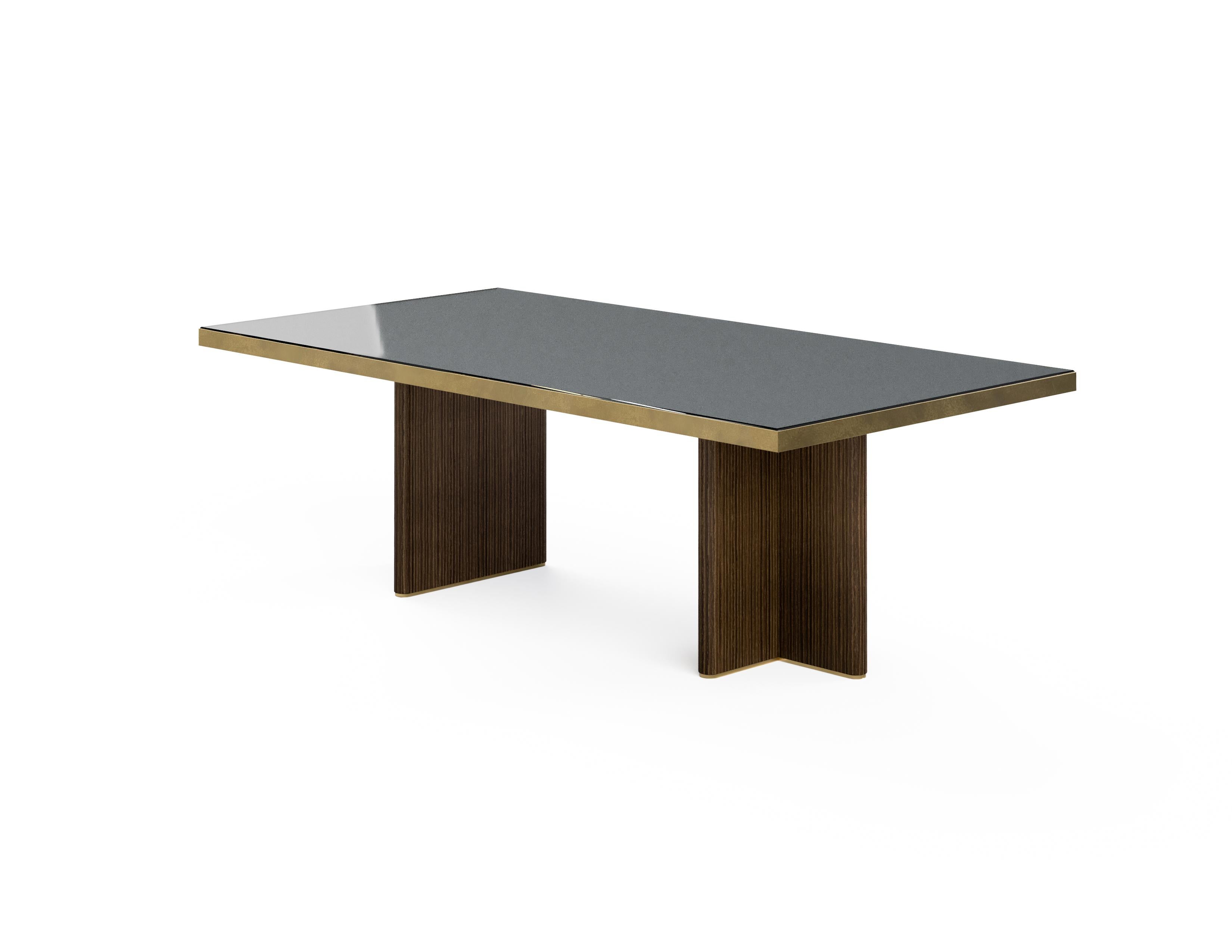The T-shaped base form of the table combined with the milling oak veneer creates a wonderful linear pattern. Frame made of acid-soaked brass, adds a different sophisticated dimension to the table.

Material & Finish 

Top: Back painted glass 

Top