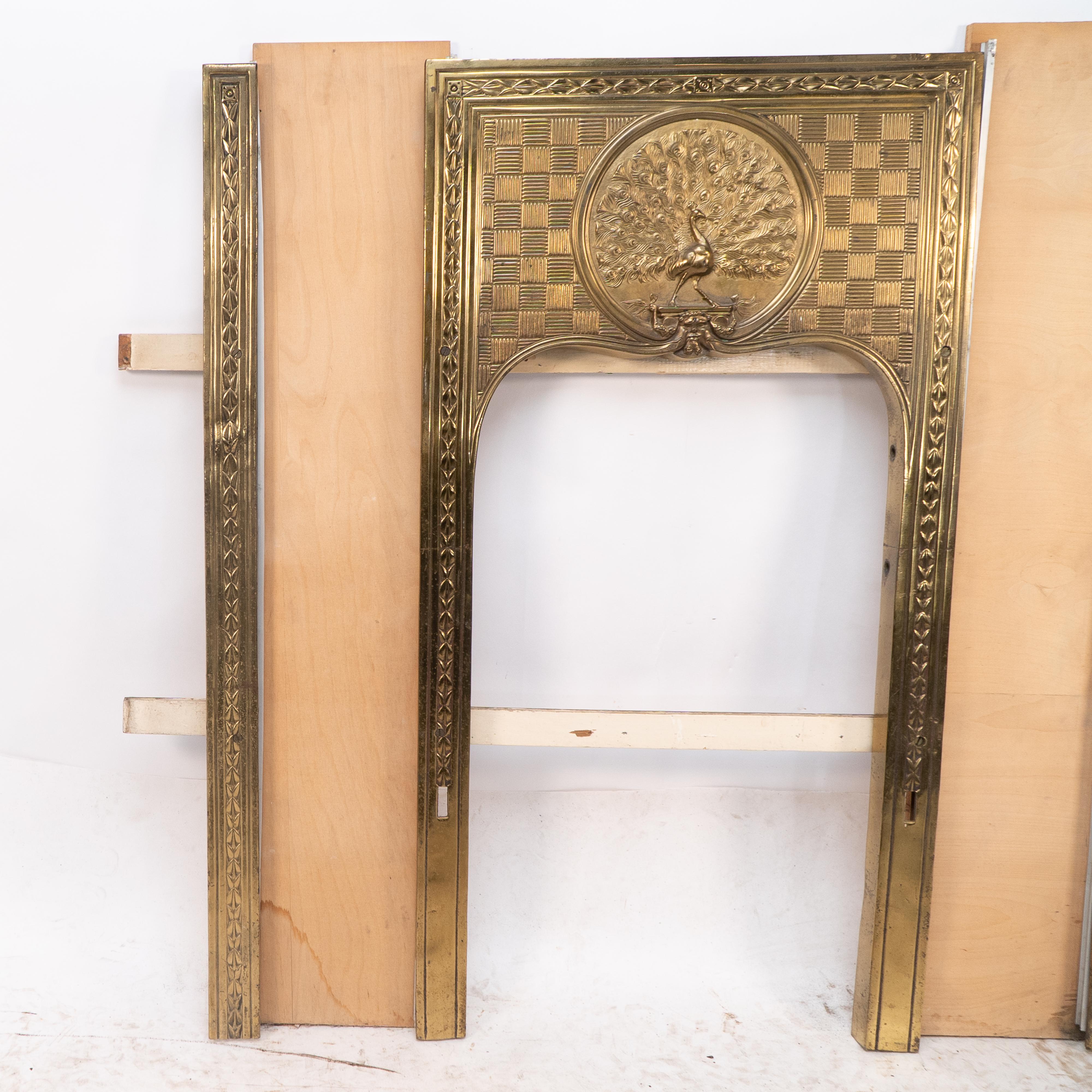 Late 19th Century T. Elsley attri. Aesthetic Movement brass fire insert w. upper central peacock For Sale
