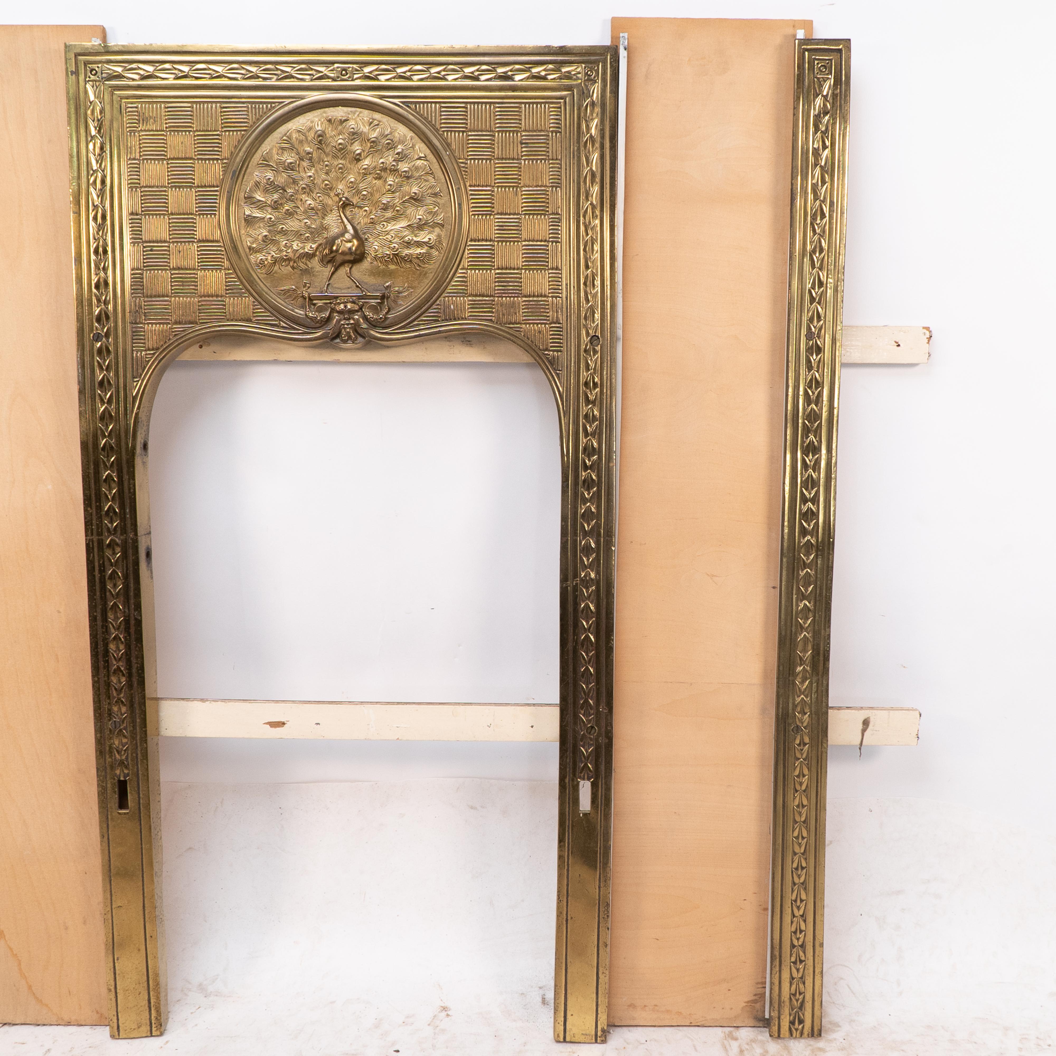 Brass T. Elsley attri. Aesthetic Movement brass fire insert w. upper central peacock For Sale