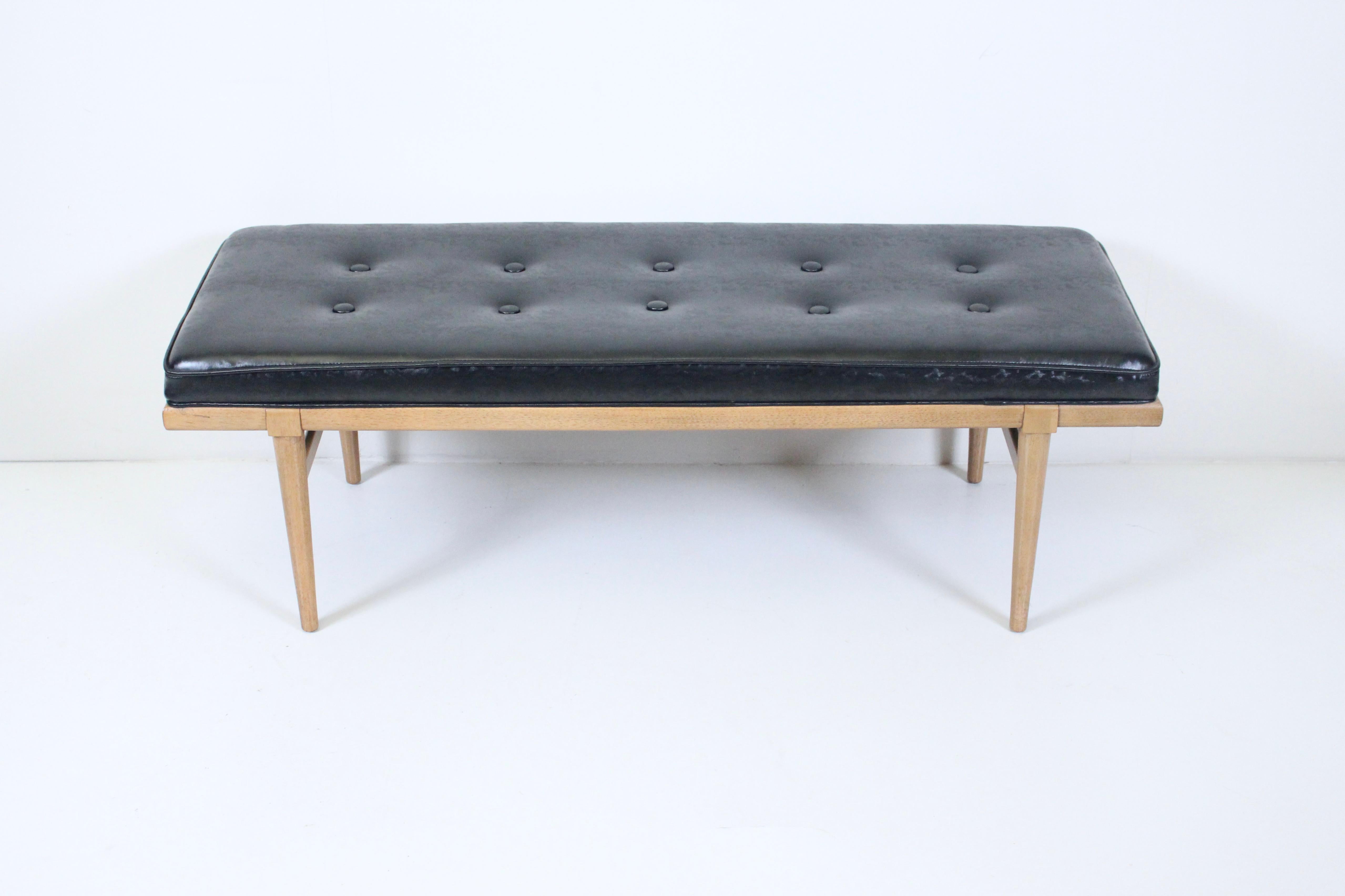 Robsjohn-Gibbings for Widdicomb bleached mahogany bench with tufted black vinyl surface. Featuring a sturdy rectangular braced, solid Mahogany frame, button tufted, finished in impressed, patterned faux black leather. Coffee table with tray.