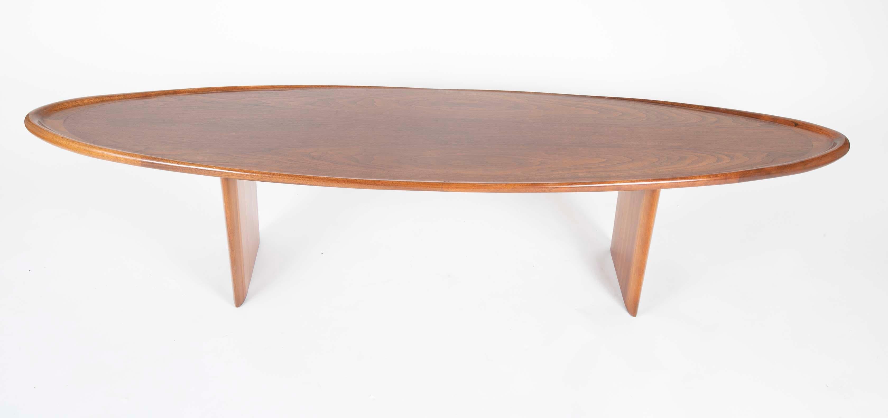 T. H. Robsjohn-Gibbings (1905-1976) for Widdicomb elongated oval coffee table with lipped ends.