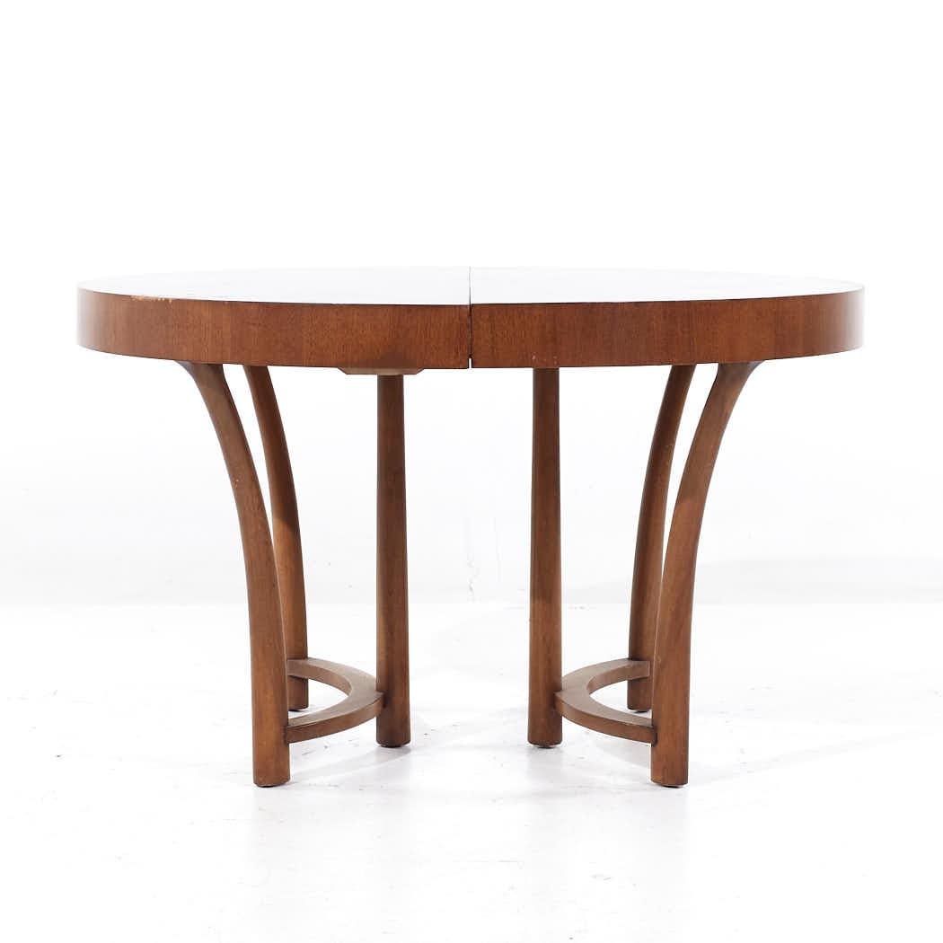 T. H. Robsjohn-Gibbings for Widdicomb Mid Century Walnut Expanding Dining Table with 3 Leaves

This table measures: 48 wide x 48 deep x 28.5 inches high, with a chair clearance of 25 inches, each leaf measures 12 inches wide, making a maximum table