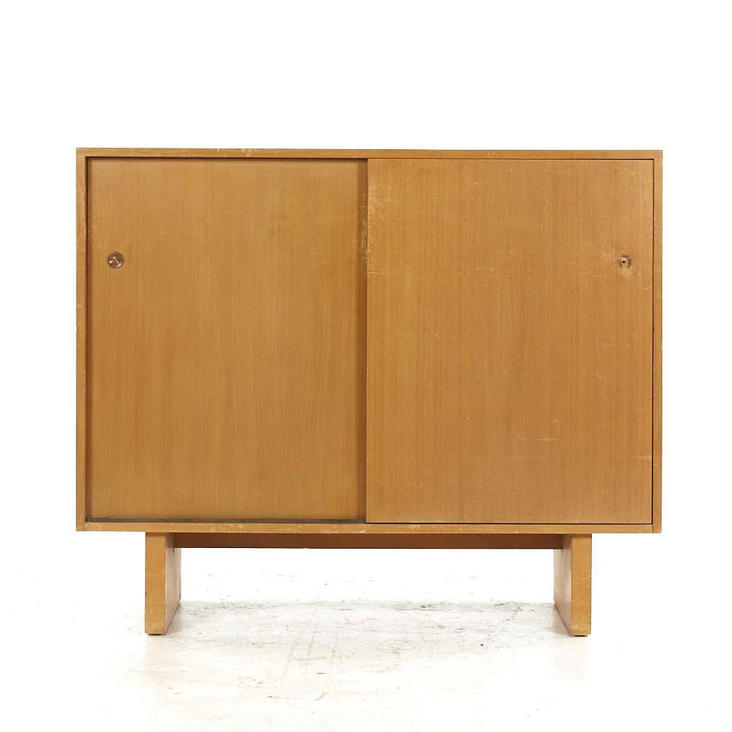 T. H. Robsjohn-Gibbings for Widdicomb Sliding Door Cabinet

This cabinet measures: 51.5 wide x 18.5 deep x 43 inches high

All pieces of furniture can be had in what we call restored vintage condition. That means the piece is restored upon purchase