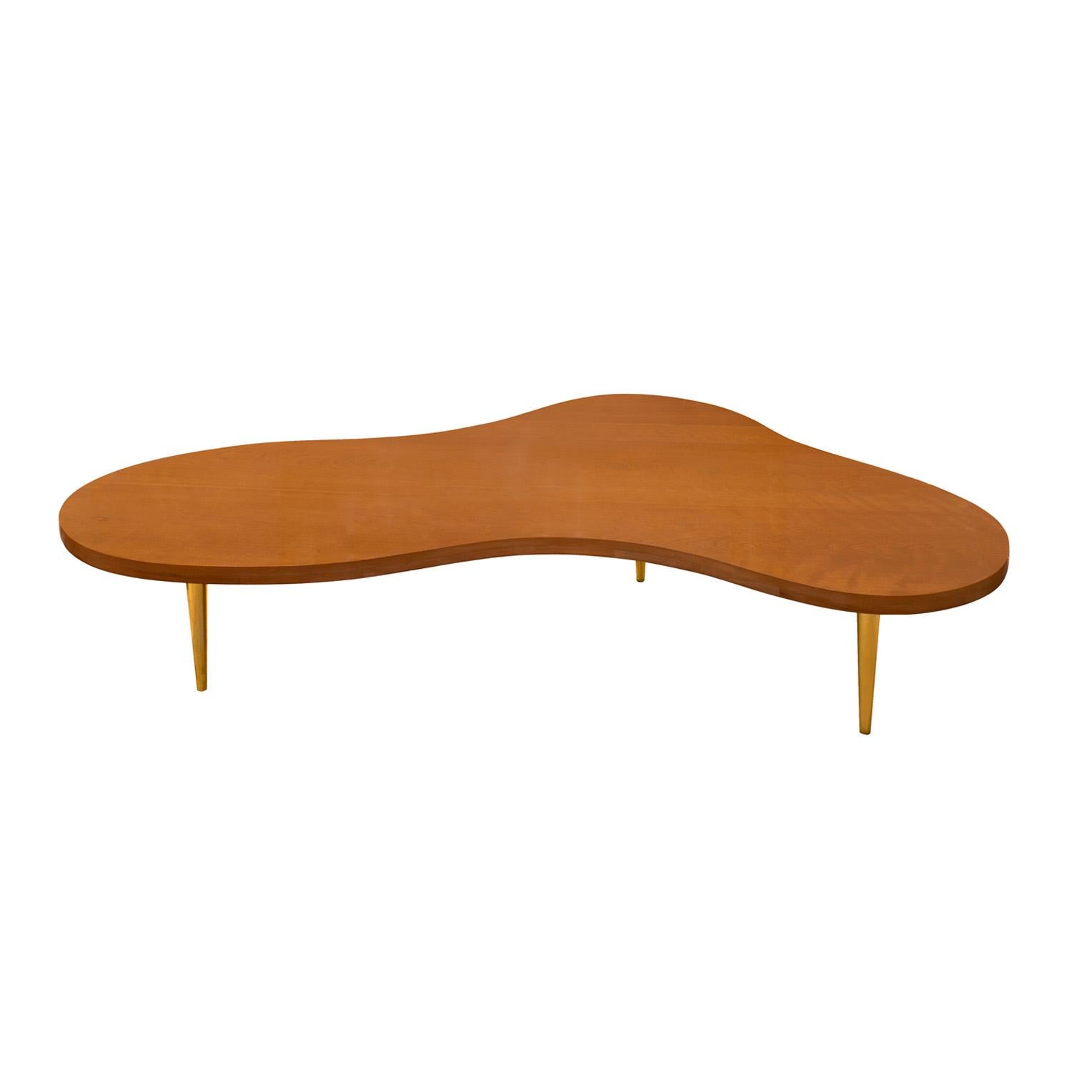 Iconic coffee table model no. 1759 in walnut with tapering conical brass legs by T.H. Robsjohn-Gibbings for Widdicomb, American 1950's (signed with Widdicomb label on bottom).  This table is super chic.  It has been newly refinished.