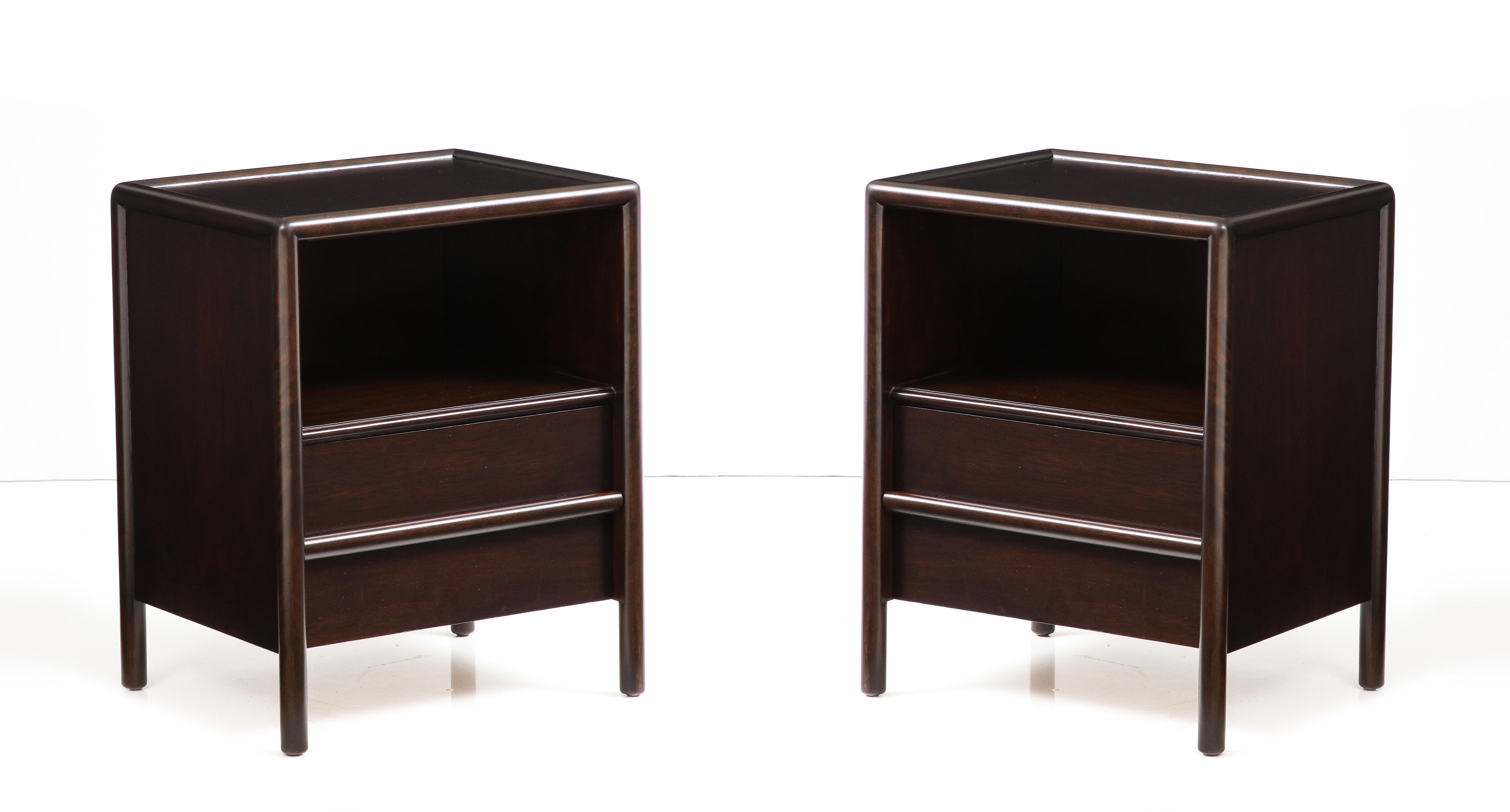 Pair of Modernist nightstands restored in a custom sable brown finish featuring a bottom drawer and storage compartment. Designed by Gibbings for Widdicomb. Labeled.