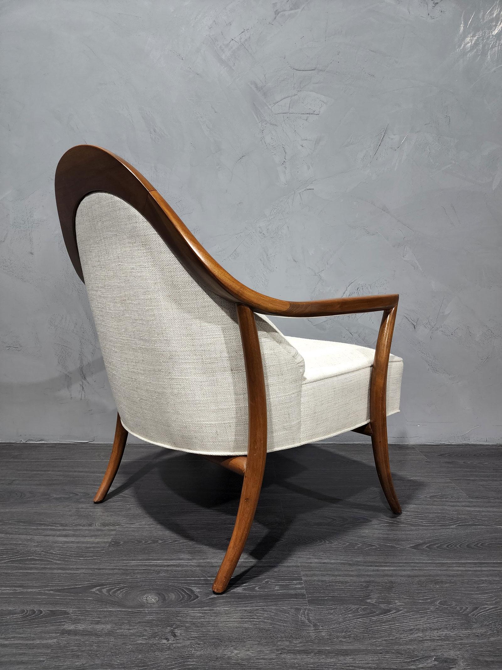 Graceful and comfortable lounge chair by T.H. Robsjohn-Gibbings. We have reupholstered in a high-quality neutral fabric.