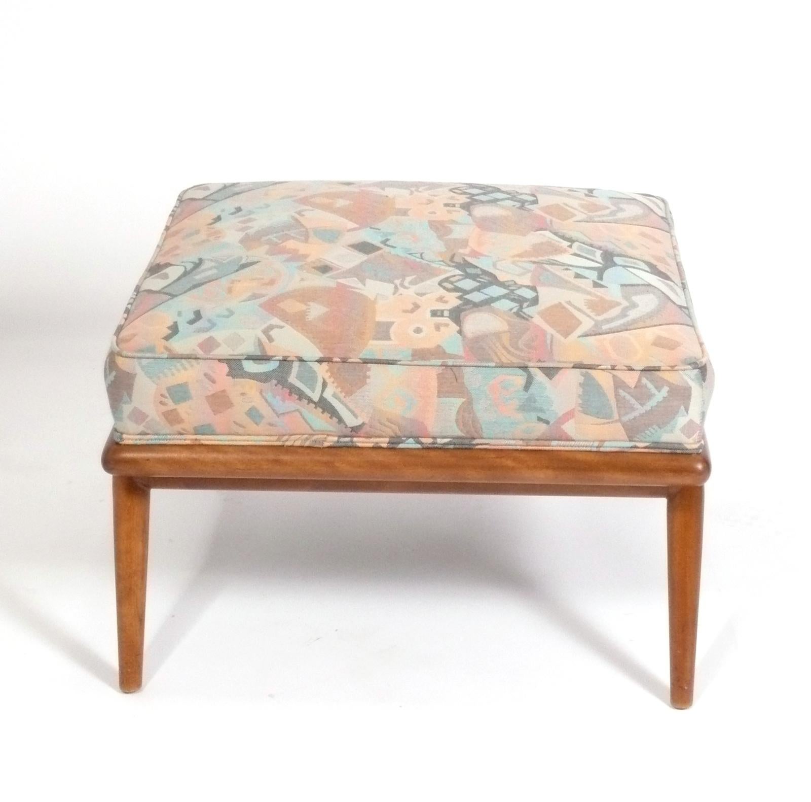 Elegant splayed leg stool or ottoman, designed by T.H. Robsjohn Gibbings for Widdicomb, American, circa 1950s. This stool is currently being reupholstered and can be completed in your fabric. Simply send us 2 yards of your fabric after purchase.