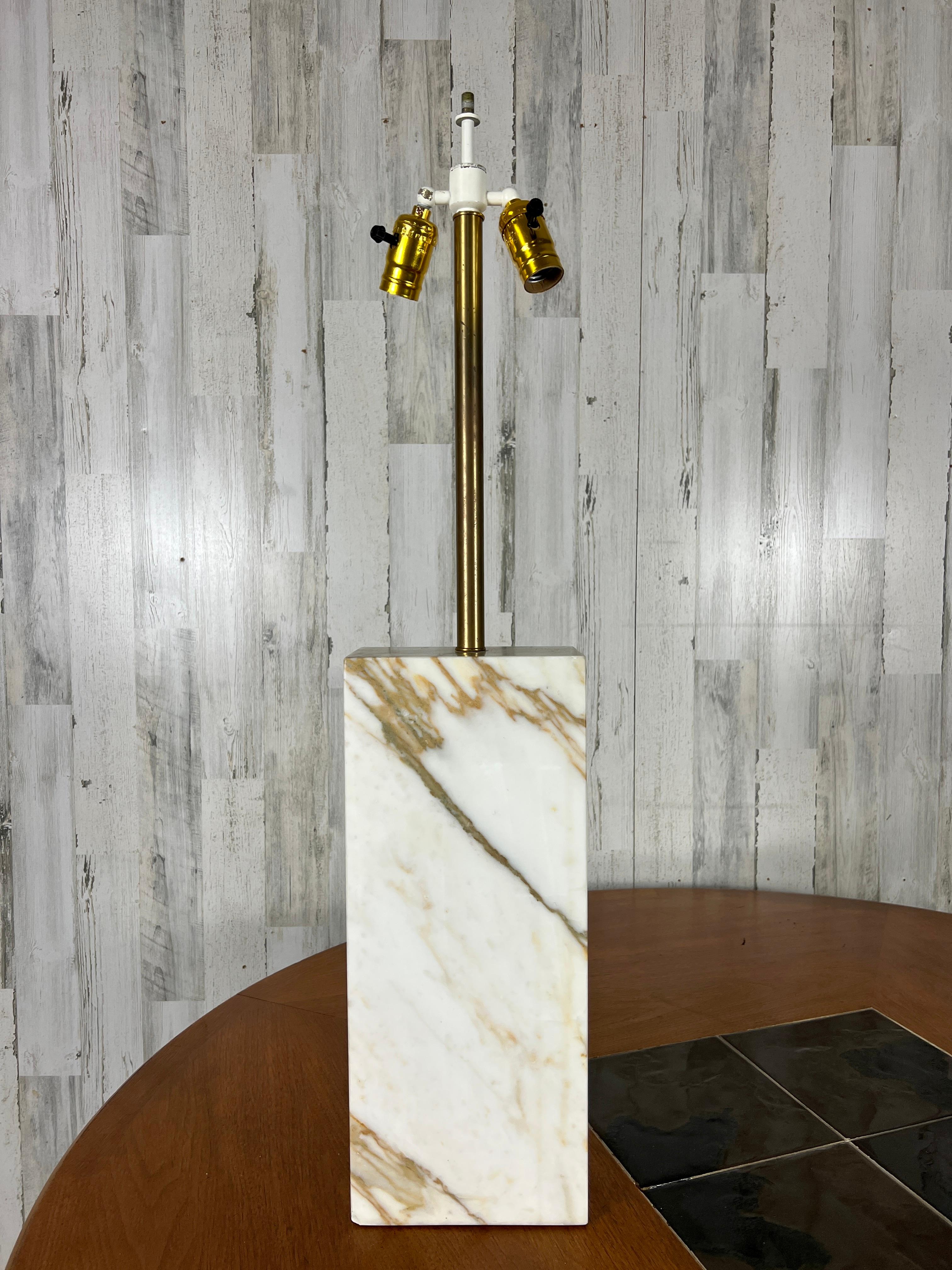 Beautifully veined marble cut into a rectangle with double sockets for maximum lighting.
 