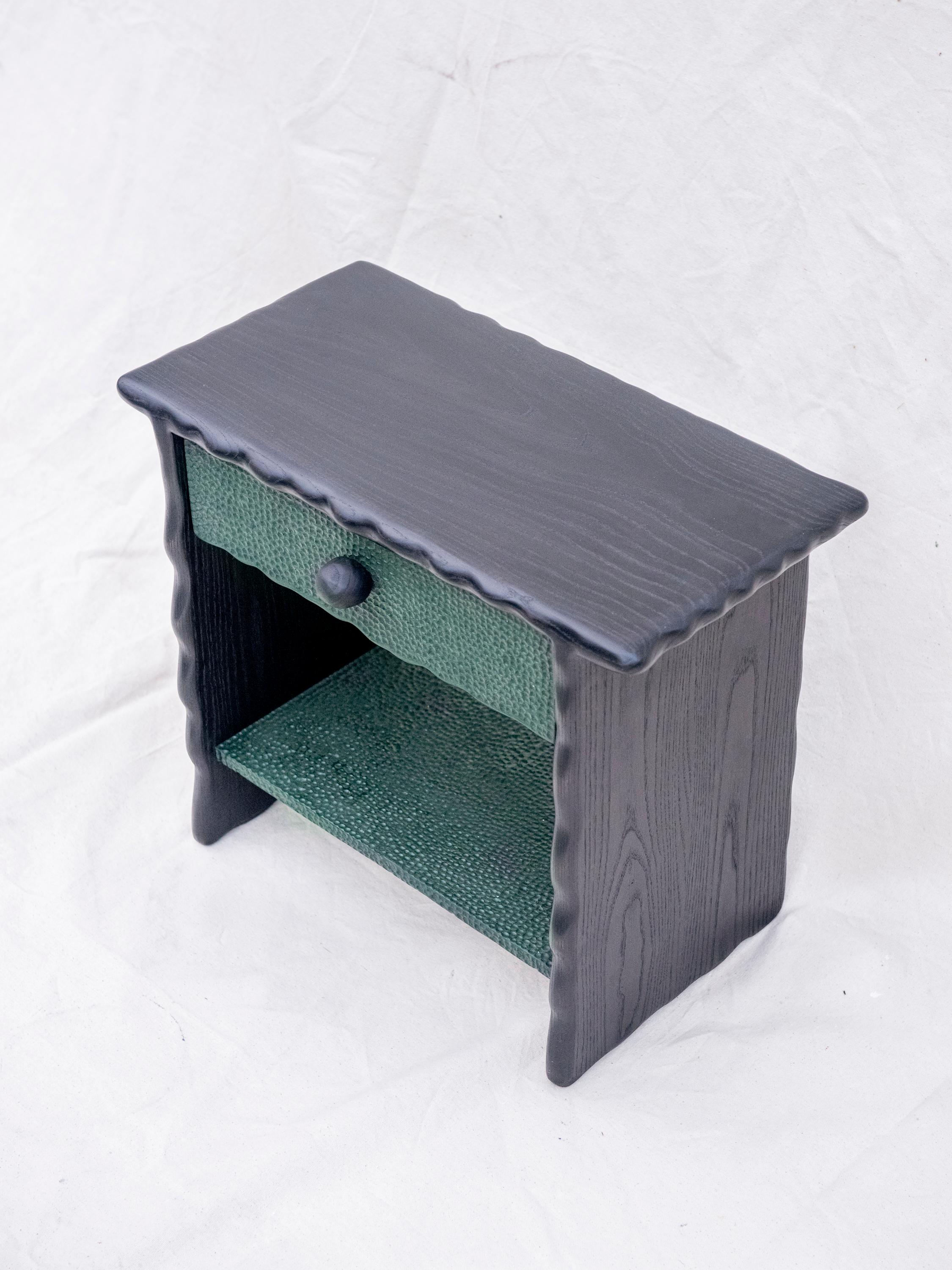 T Nightstand by Luke Malaney
Dimensions: H 46 x D 35.5 x W 51 cm
Materials: Pigmented Ash
Natural oil/wax finish

Luke Malaney designs and creates one of a kind pieces of furniture that are made to last. Using old world joinery, elegant design, and