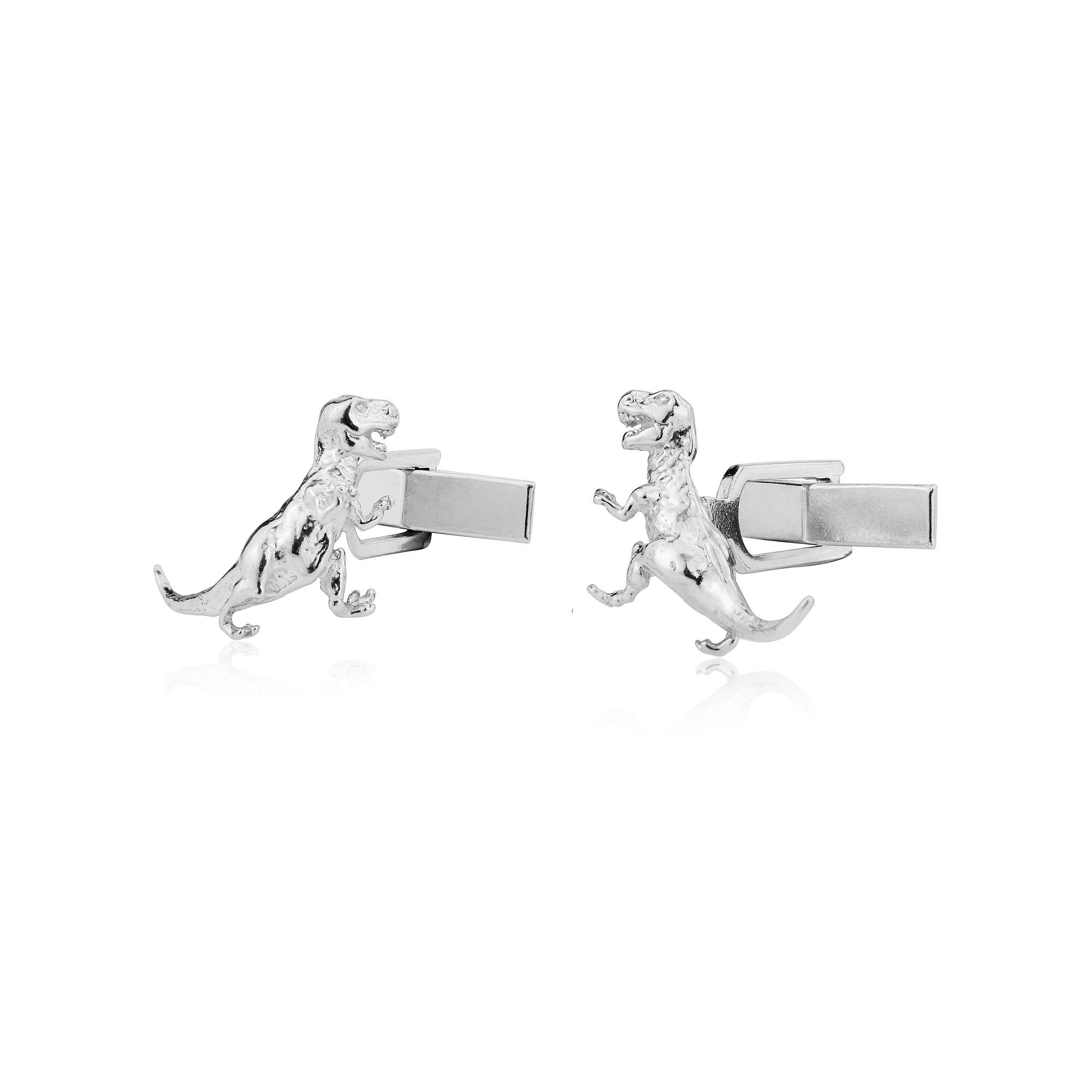 Simon Kemp , a third generation English jeweller,  has taken a vintage charm, made it into a mould, and turned this into a pair of highly detailed sterling silver cufflinks.
This miniature sculpture captures the essence of this dinosaur which ruled