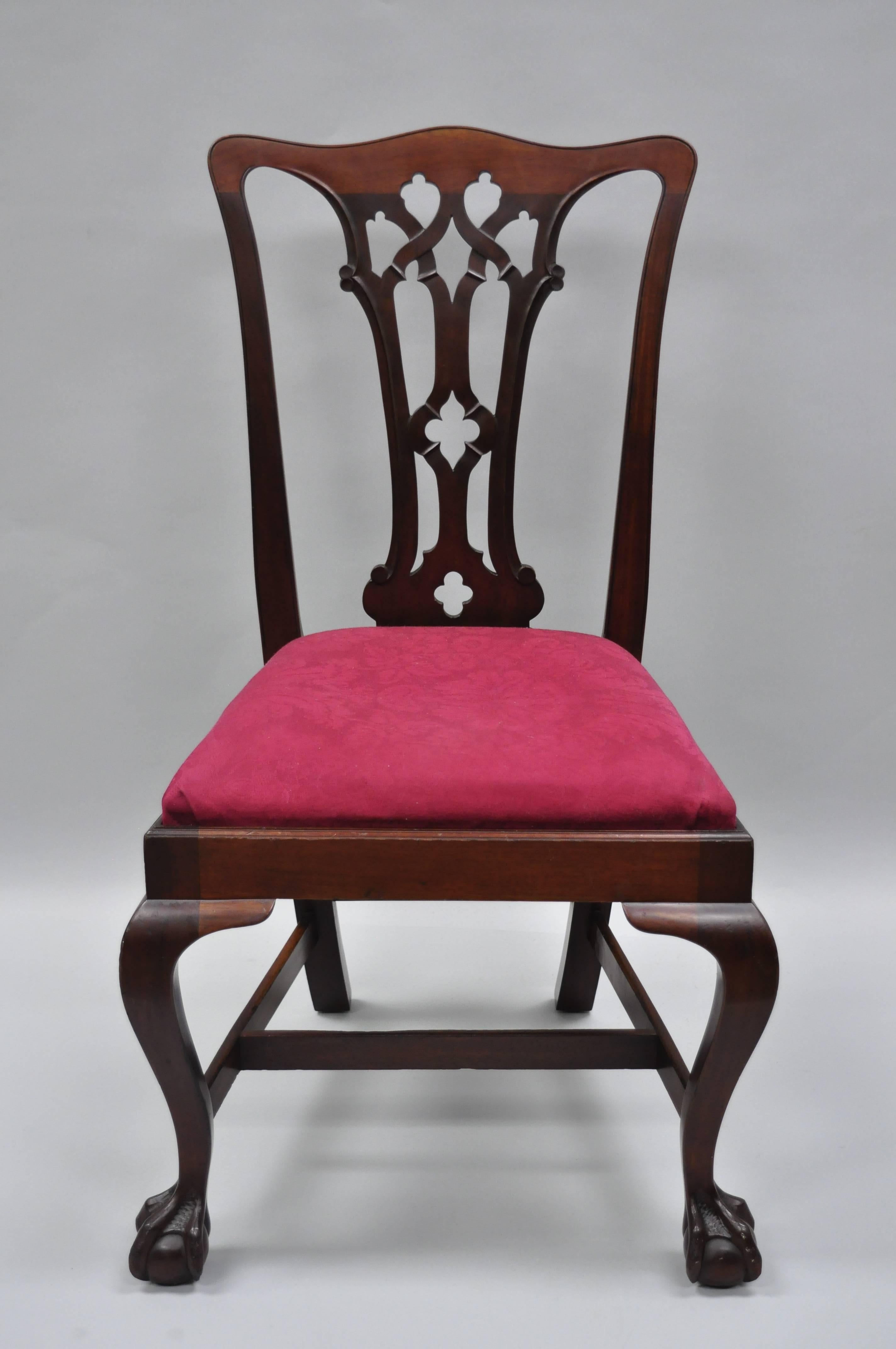 A pair of T. Robinson & Sons Makers antique solid mahogany side chairs. Item features horsehair seat fill, branded to underside, solid wood construction, beautiful wood grain, cabriole legs, carved ball and claw feet, quality American craftsmanship,