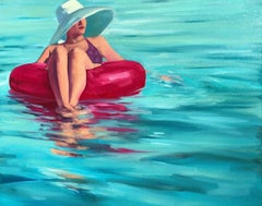 "Drifting" oil painting of a woman in hat floating in a pink tube on teal water