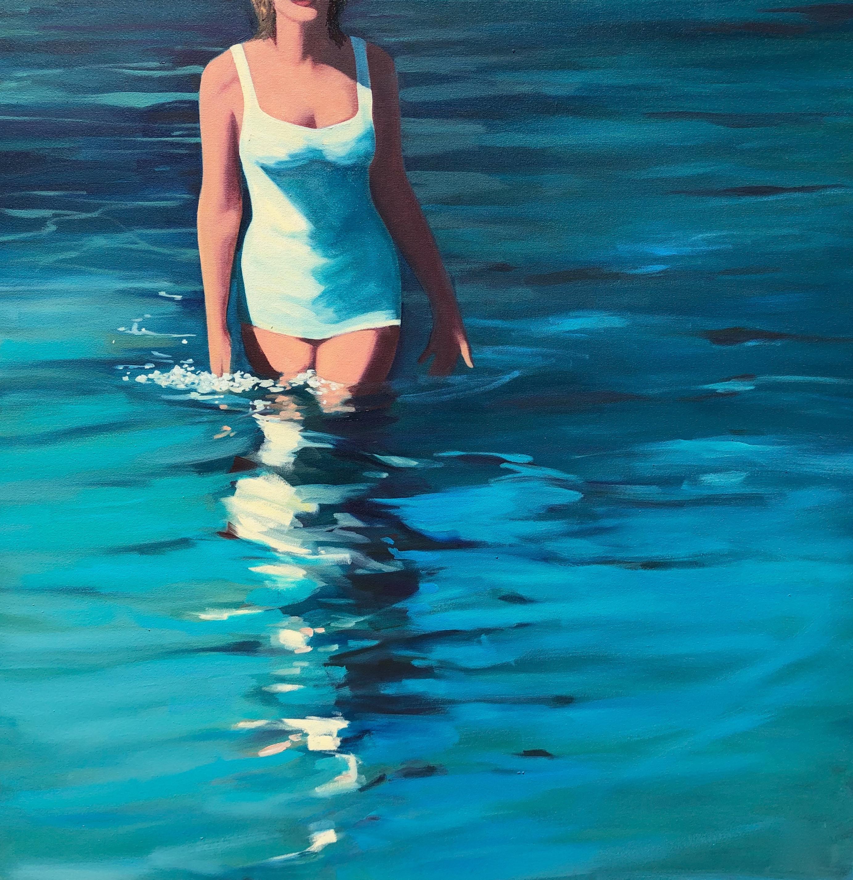 T.S. Harris Figurative Painting - "In The Surf" oil painting of a woman wading into blue water in a white swimsuit