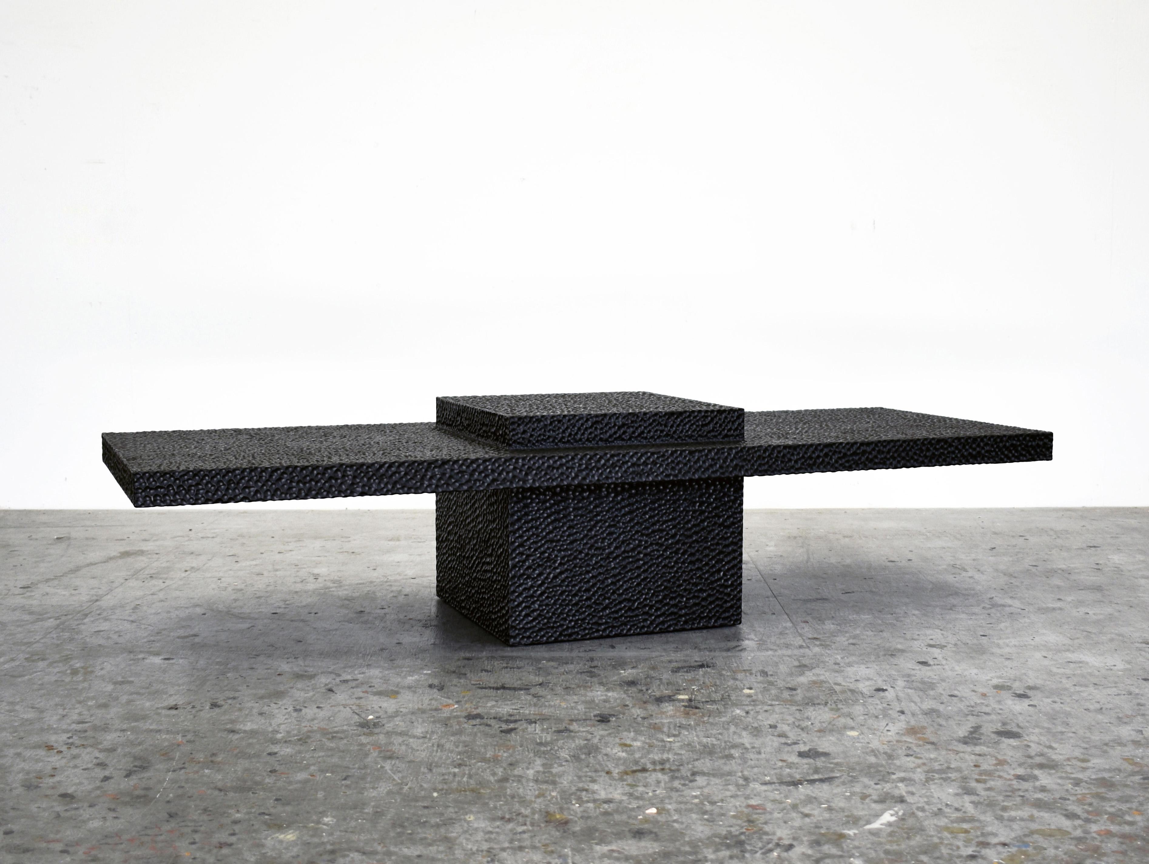 T1 coffee table by John Eric Byers
Dimensions: 35.5 x 152.4 x 55.9 cm
Materials: carved blackened maple

All works are individually handmade to order.

John Eric Byers creates geometrically inspired pieces that are minimal, emotional, and