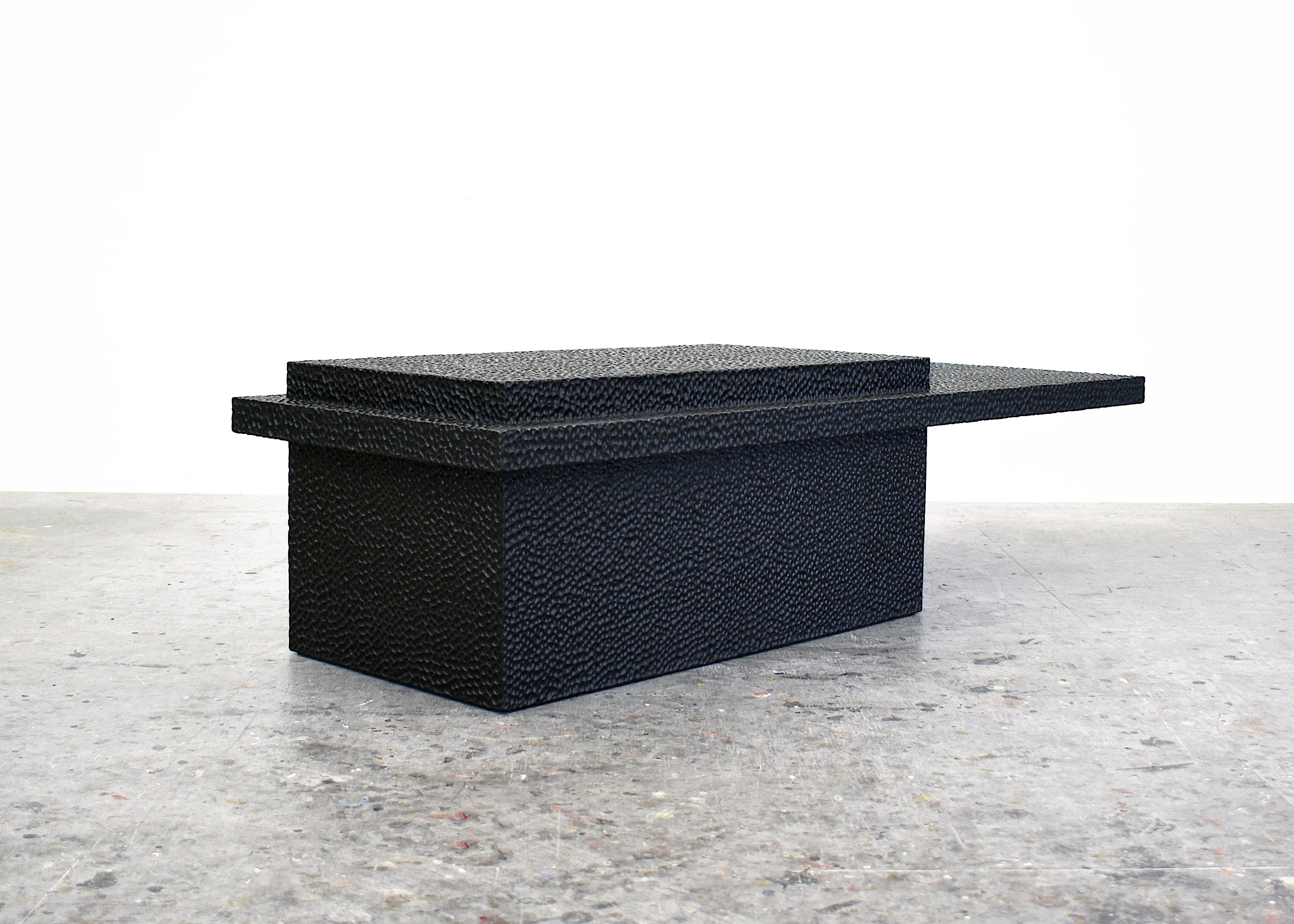 T2 coffee table by John Eric Byers
Dimensions: 35.5 x 155 x 55.9 cm
Materials: carved blackened Maple

All works are individually handmade to order.

John Eric Byers creates geometrically inspired pieces that are minimal, emotional, and