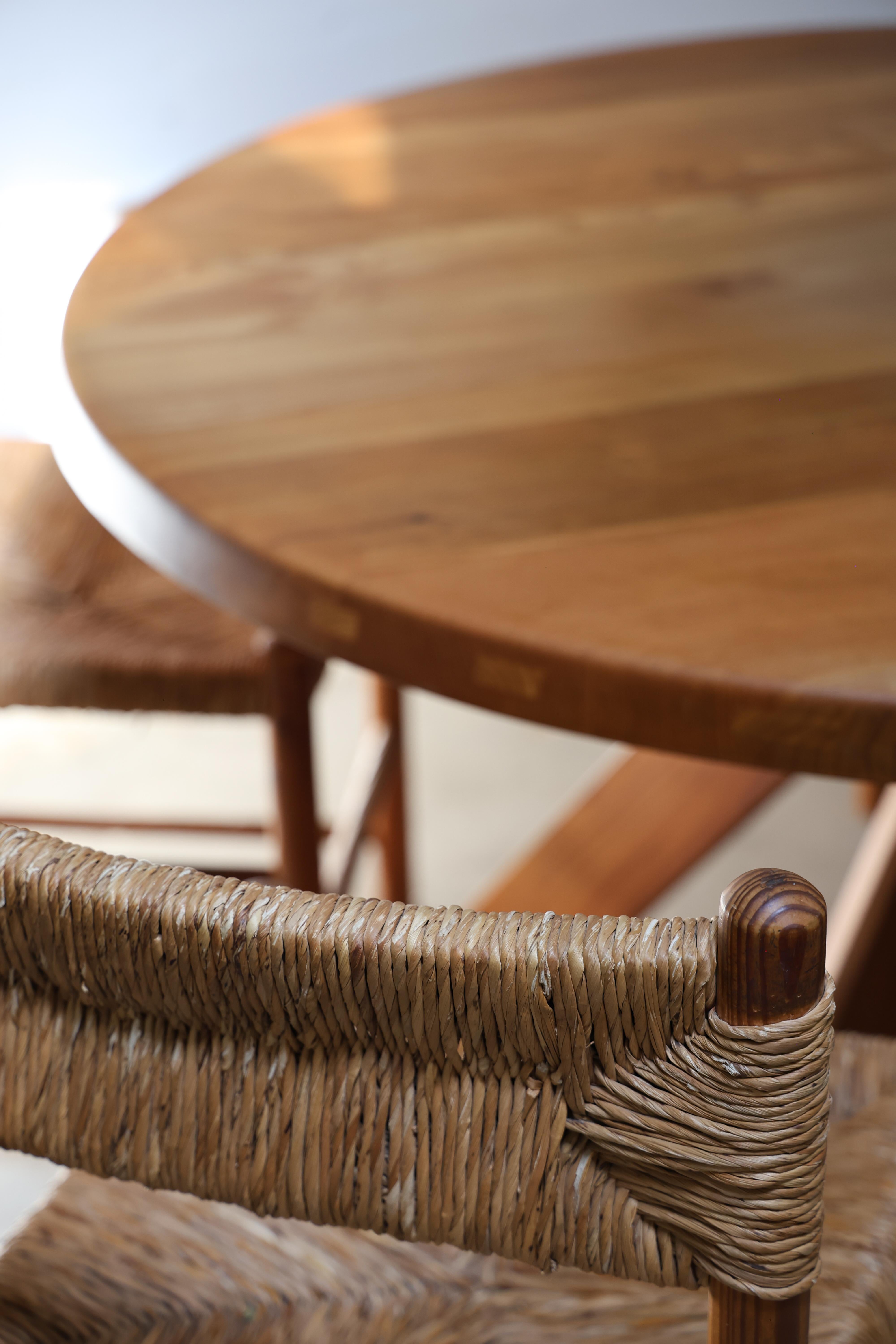 Designed by French master craftsman Pierre Chapo (1927–1987), this round dining table exemplifies his devotion to honest construction, geometric clarity, and the expressive potential of solid wood. Chapo’s work emerged in the postwar decades when