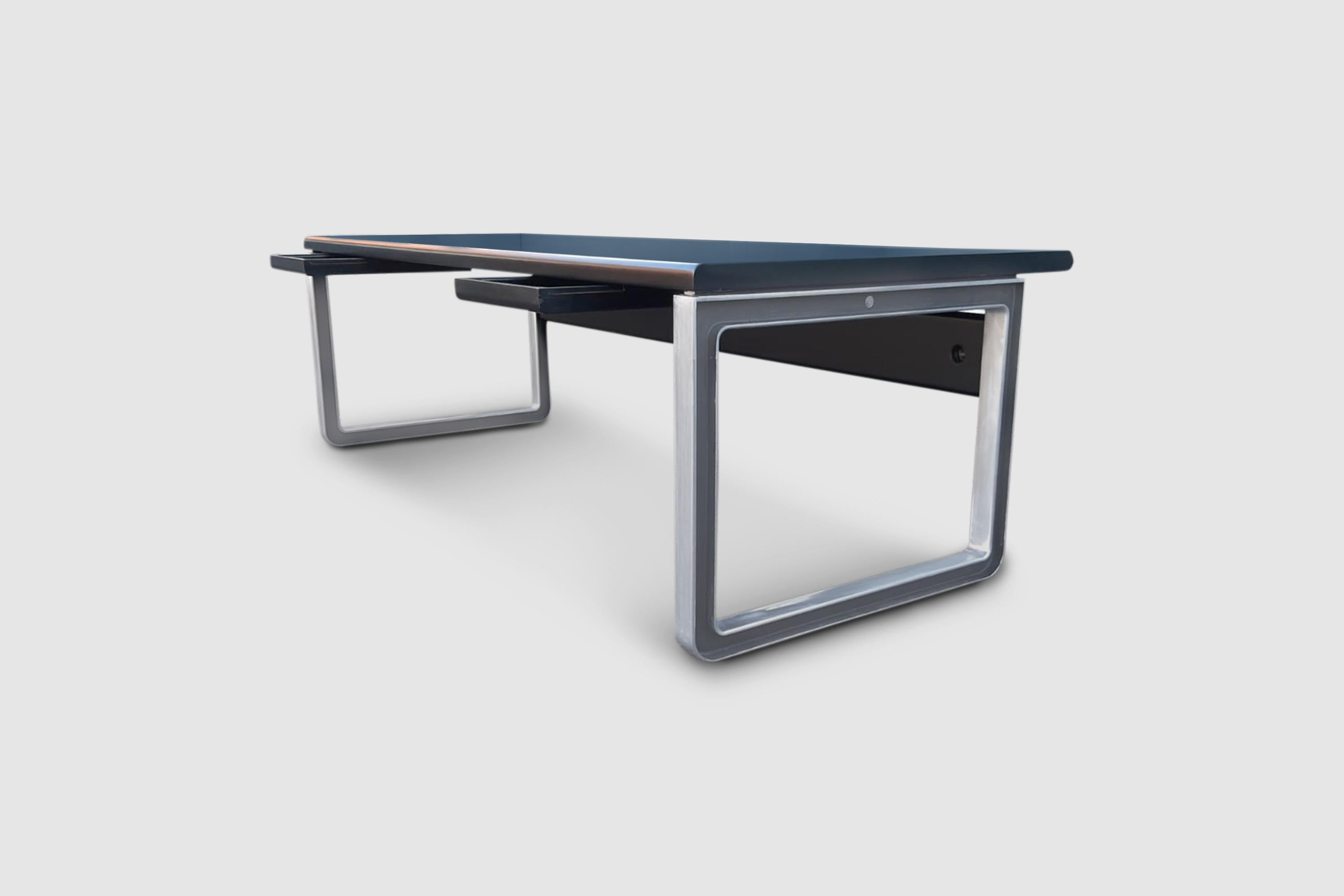 Impressive desk by Eugenio Gerli and Osvaldo Borsani for Tecno SpA, designed in 1975 by Eugenio Gerli and Osvaldo Borsani for Tecno SpA Italy.

It is made with excellent wood and polished steel bases. The top consists of solid walnut wood covered