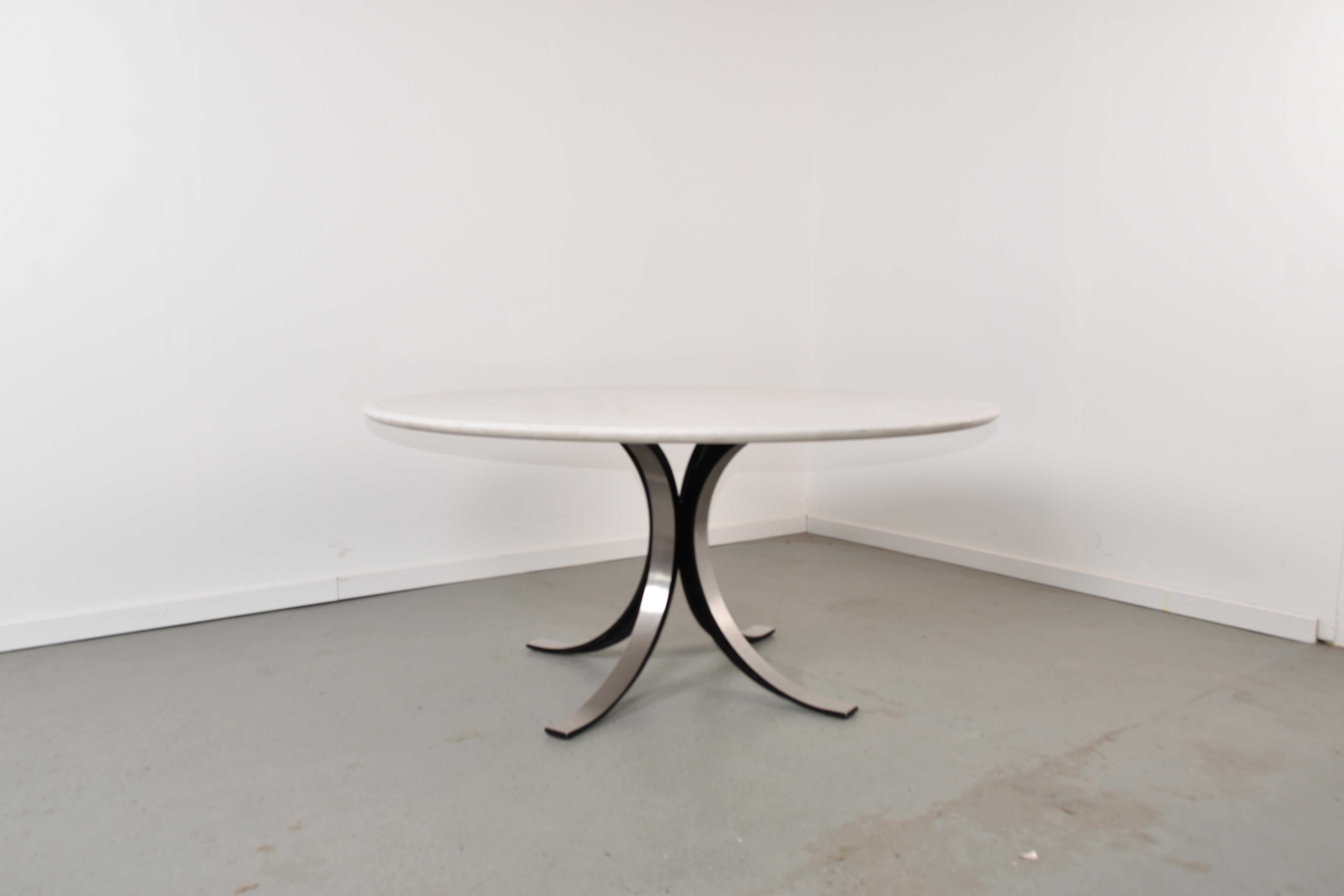 T69 low dining table by Osvaldo Borsani & Eugenio Gerli for Tecno.

The table top is solid white marble in good condition with some signs of use consistent with age.

The base is made from slender metal and give a curvacious and modern