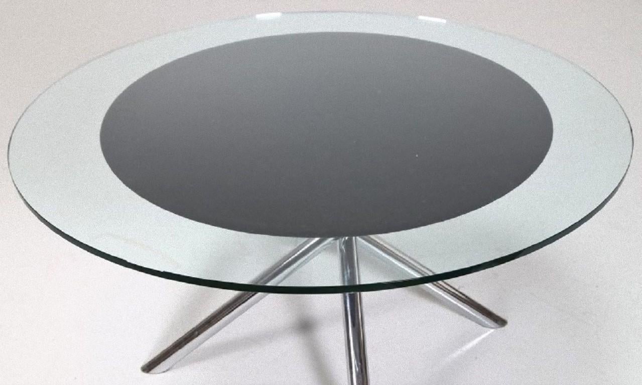 T70 vintage table is an elegant piece of design furniture designed by Carlo Bartoli for the Italian Manufacturer Tisettanta in the 1970s.

Oval table with shromed metal legs and cut crystal top.
Clean and noble form based around Carlo Bartoli's