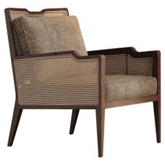Tabac Ash Lounge Chair With Rattan Detailing On The Back And Arms