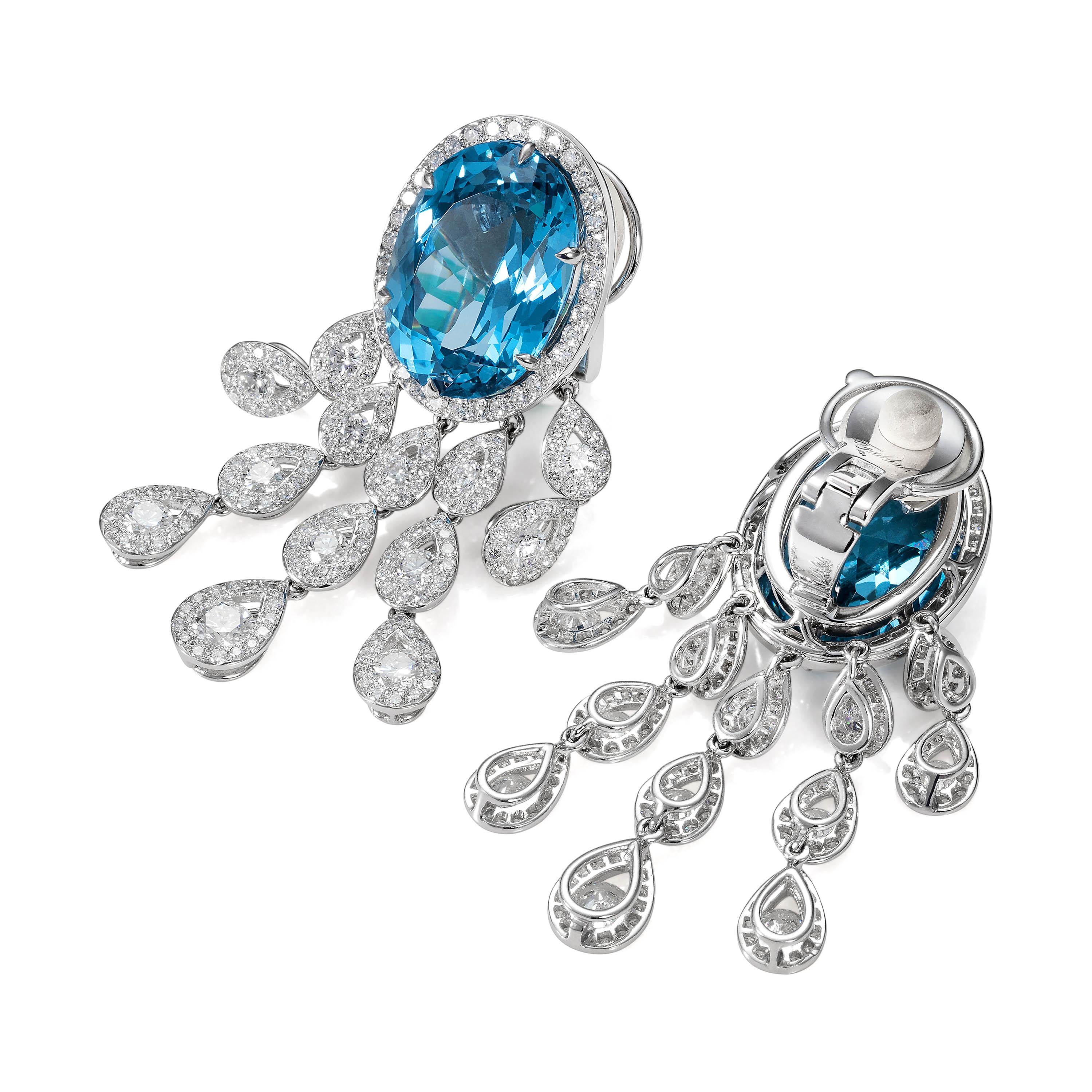 Pair of faceted blue topaz earrings weighing 28.85 carats with 412 round diamonds weighing 5.00 carats.
Crafted in 18k white gold

Earring legth: 4.3 cm

These earrings come complete with a Tabbah presentation box and certificate of authenticity.