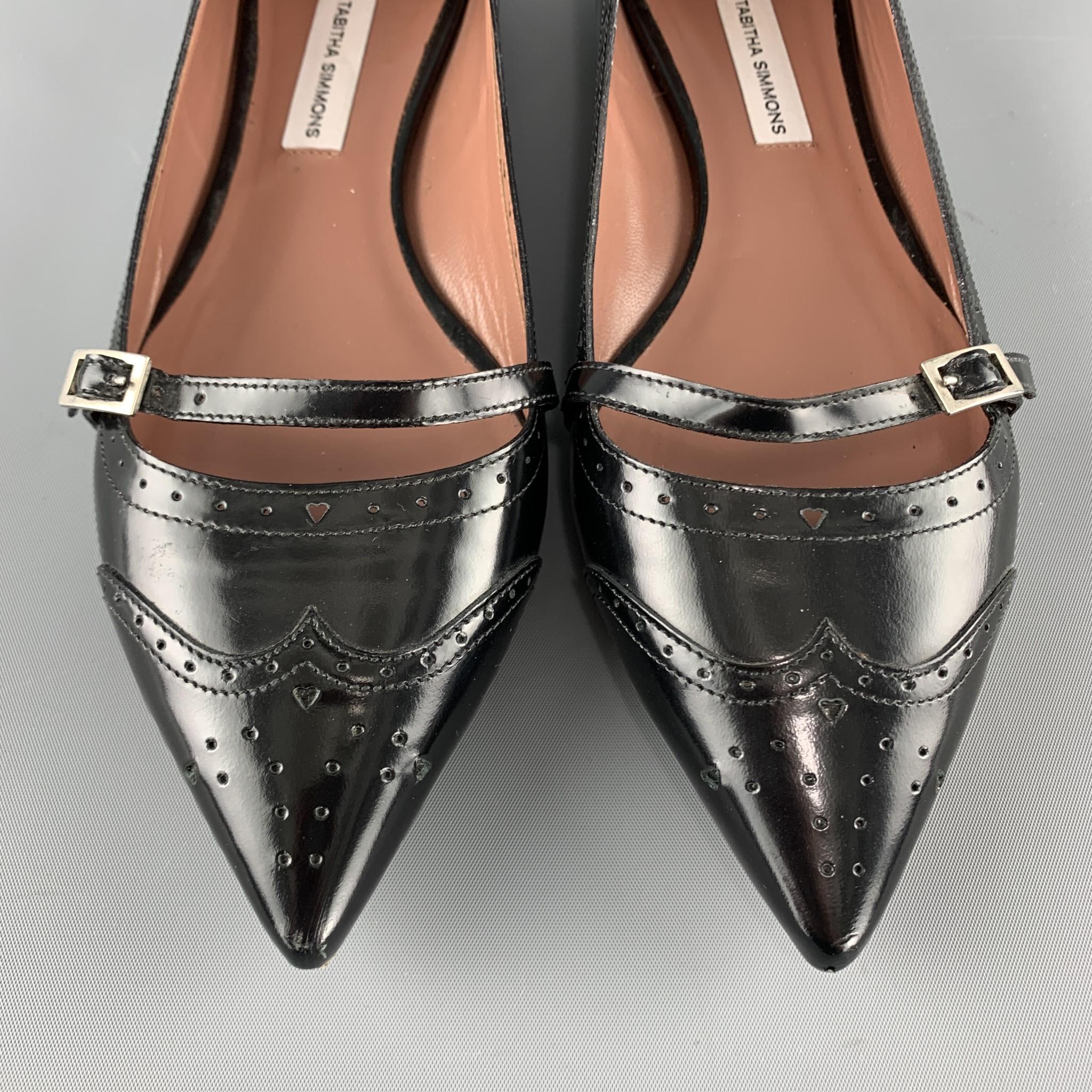 TABITHA SIMMONS flats come in black patent leather with a perforated pointed wingtip, perforated hearts trim, and Mary Jane strap. Made in Italy.

Very Good Pre-Owned Condition.
Marked: IT 37
Original Retail Price: $695.00

Outsole: 10.5 x 3 in.