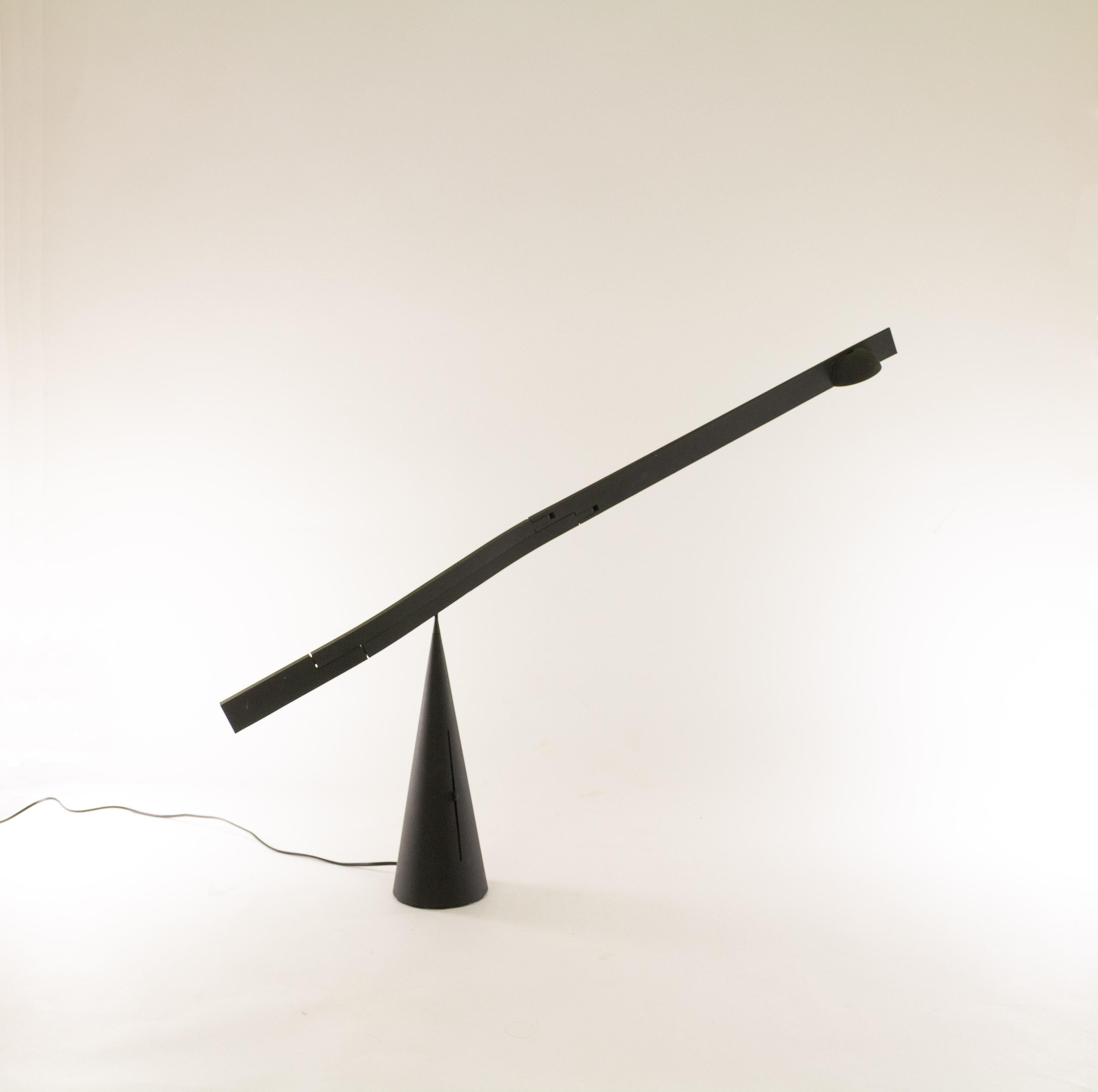 Tabla table lamp by Mario Barbaglia and Marco Colombo for Italiana Luce, 1988-1990.

Exceptional sculptural design with an adjustable and extendable arm that gracefully pivots on the peak of the cone base. The transformer of this halogen lamp