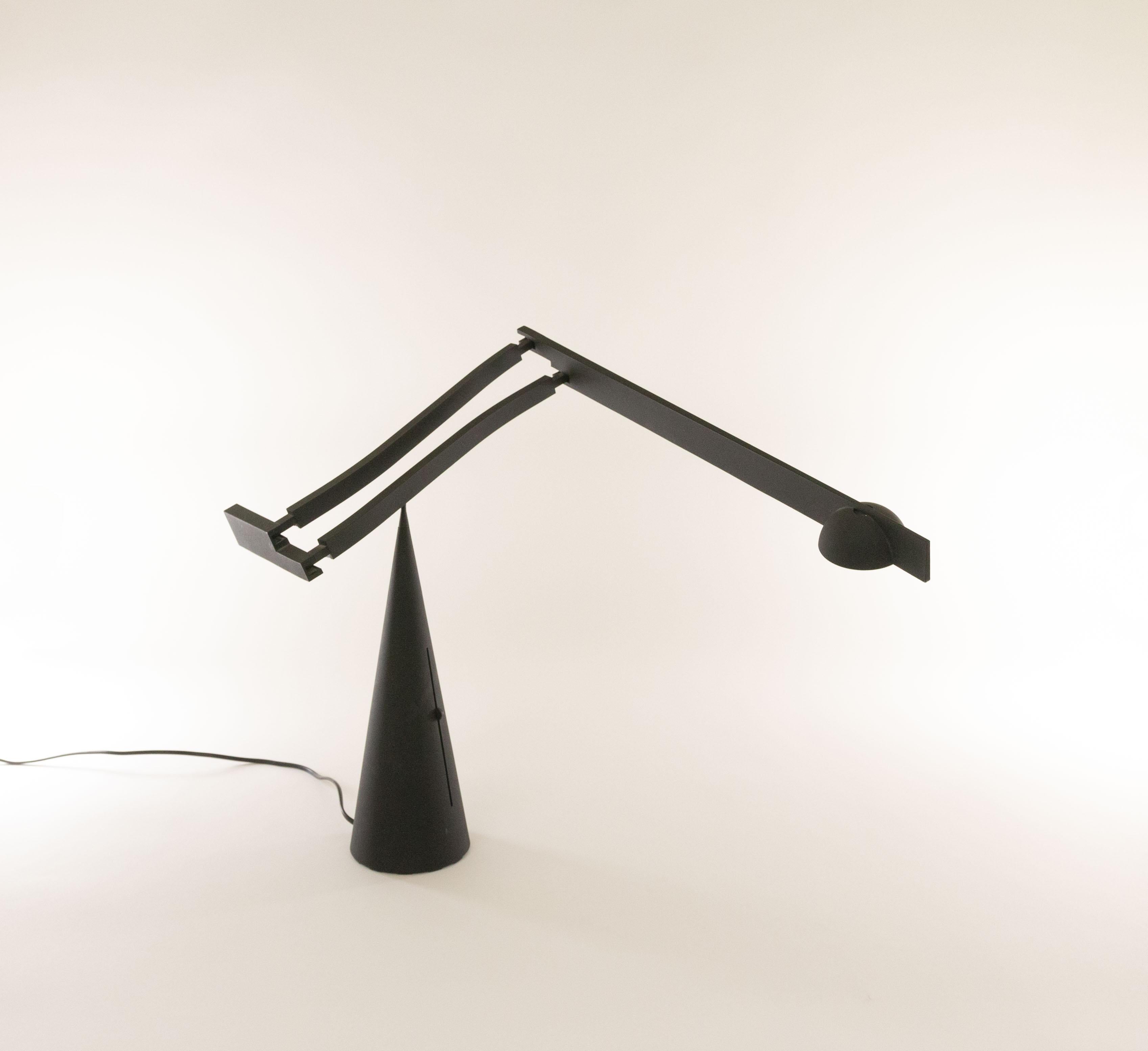 Tabla table lamp by Mario Barbaglia and Marco Colombo for Italiana Luce, 1988 - 1990.

Exceptional sculptural design with an adjustable and extendable arm that gracefully pivots on the peak of the cone base. The transformer of this halogen lamp