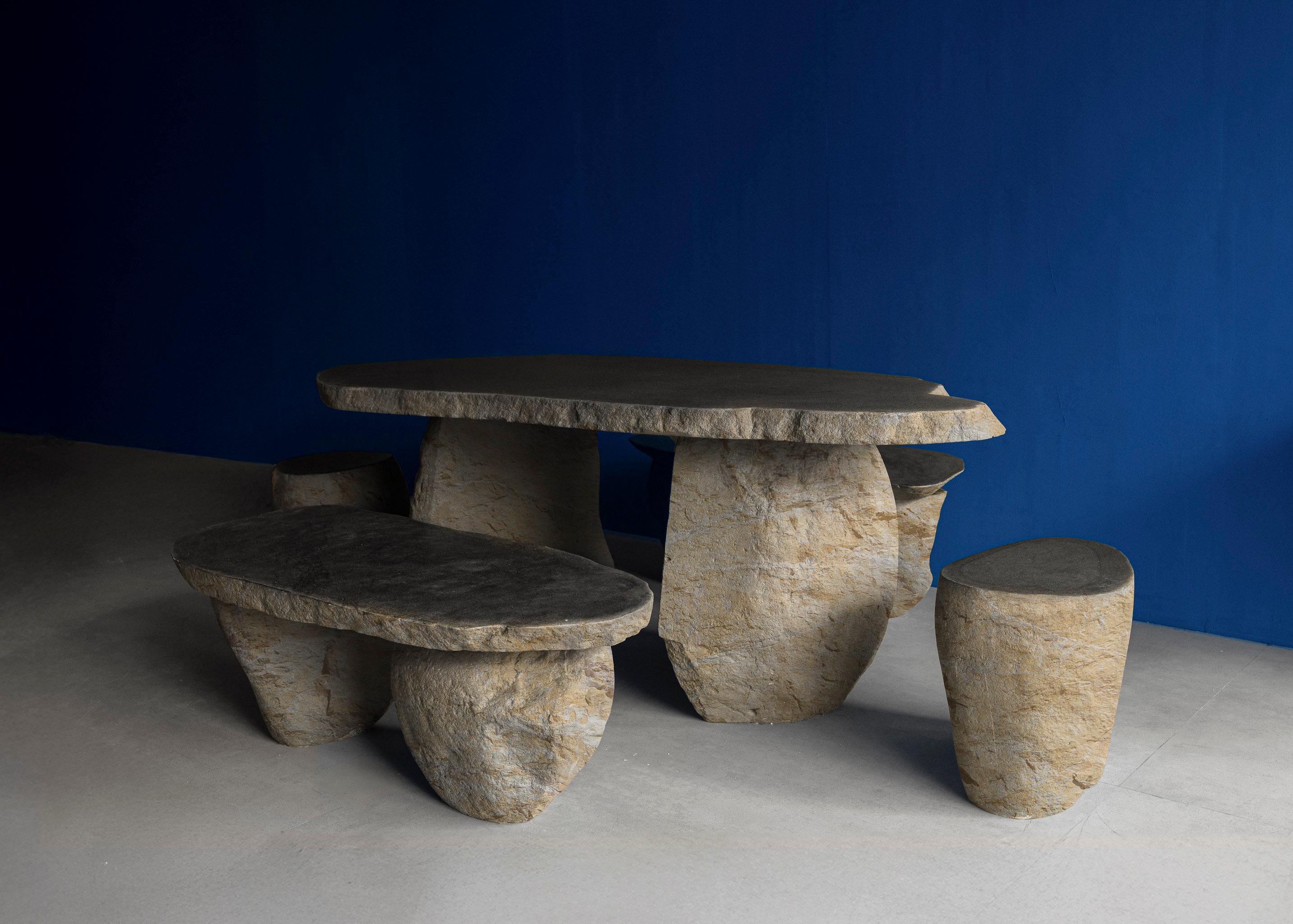 Table 77 is a monumental celebration of natural beauty and craftsmanship, sculpted entirely from river stone. Its organic contours and raw, textured surface honor the material’s innate character, reflecting the timeless interplay of nature and