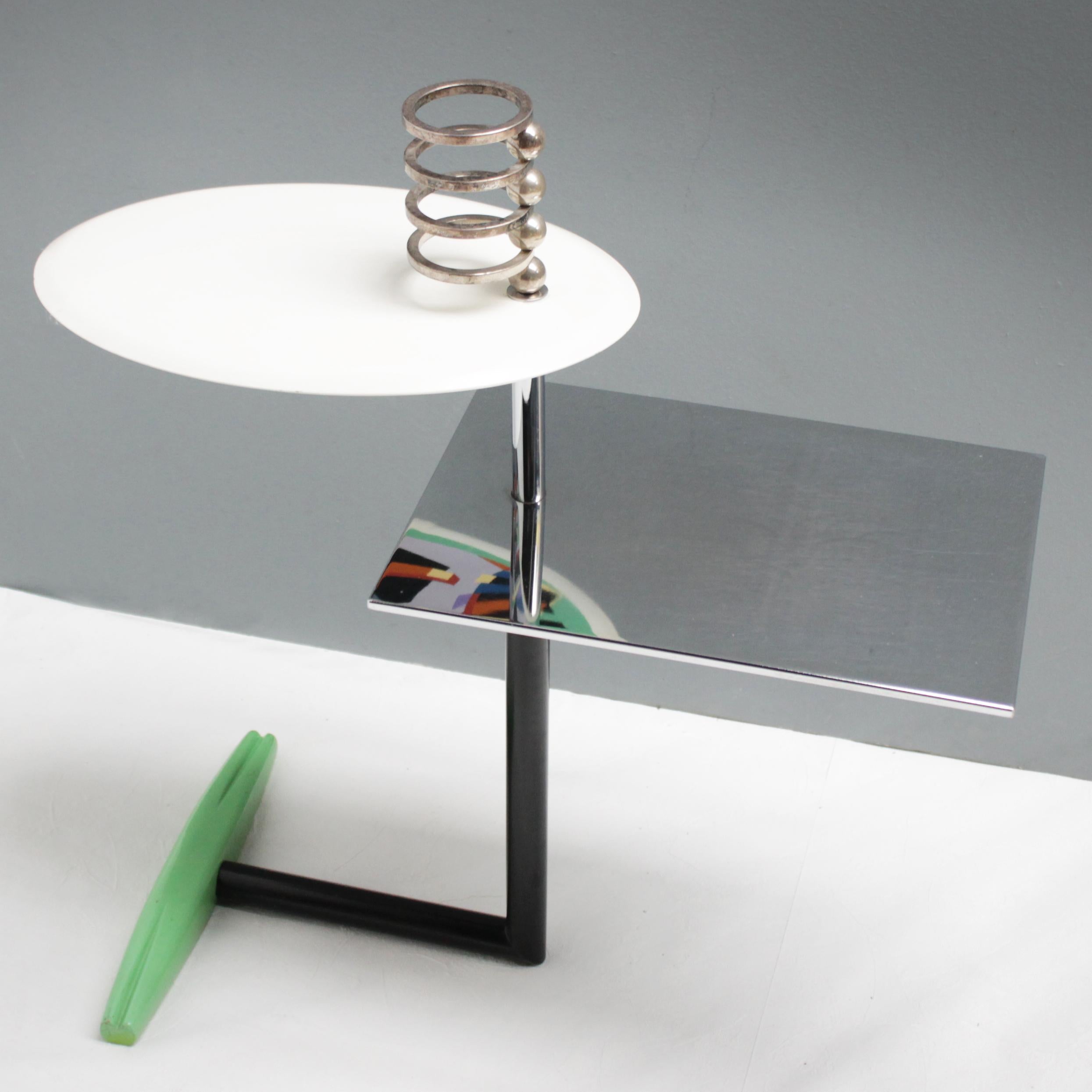 Offered a rare small table 'Acilio' by Alessandro Mendini for Zabro - Nuova Alchimia, Milan. A beautiful and stylish example of design from the Memphis group, the phenomenon from the 80s.
Cast iron with wood-covered base, green lacquered. Chrome