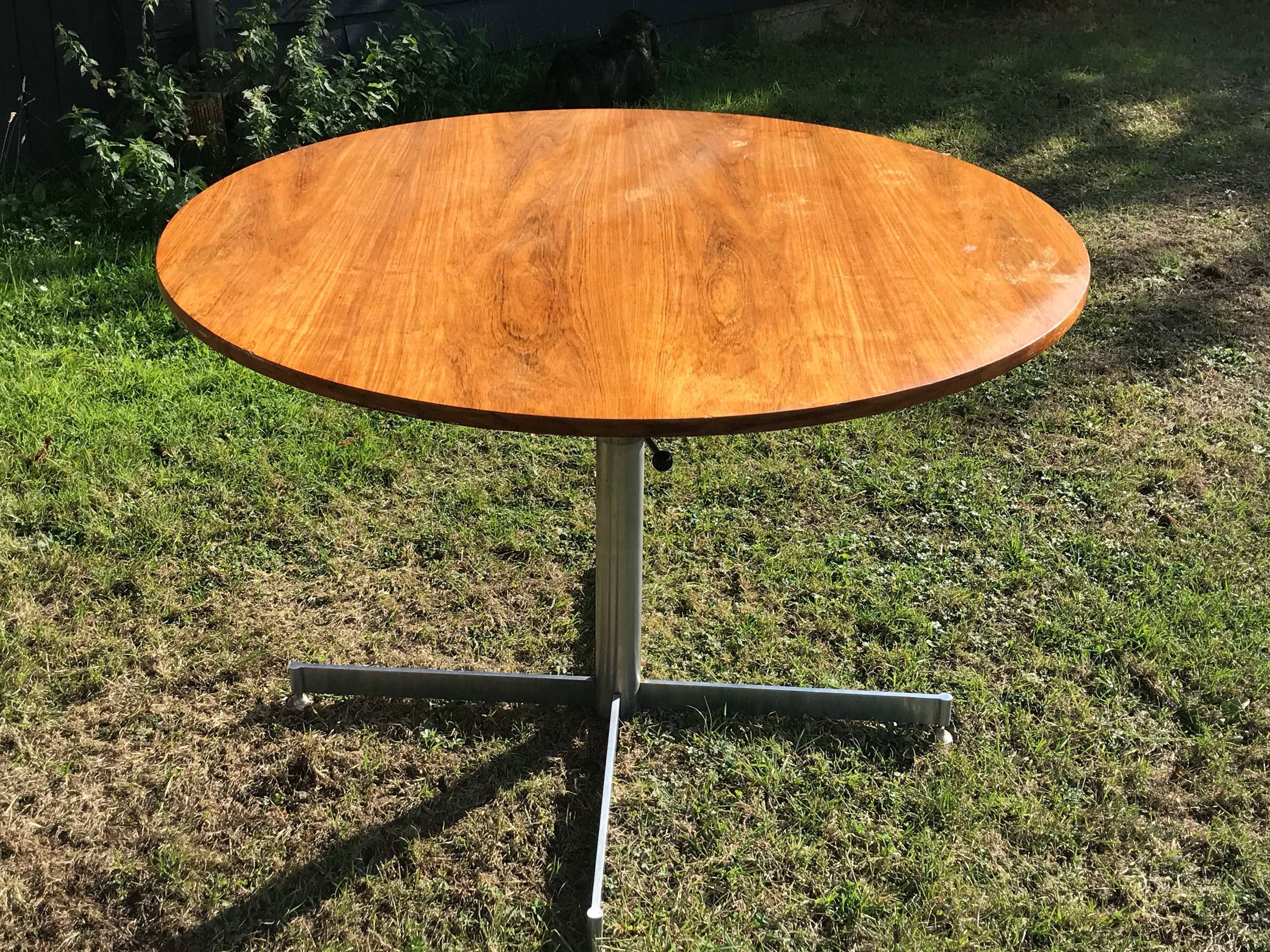 Striking, Mid-Century Modern, multi-function circular rosewood and chrome table
The adjustable rosewood top repurposes the function with the height from dining, centre, occassional to low, coffee, sofa
The rosewood top is beautifully