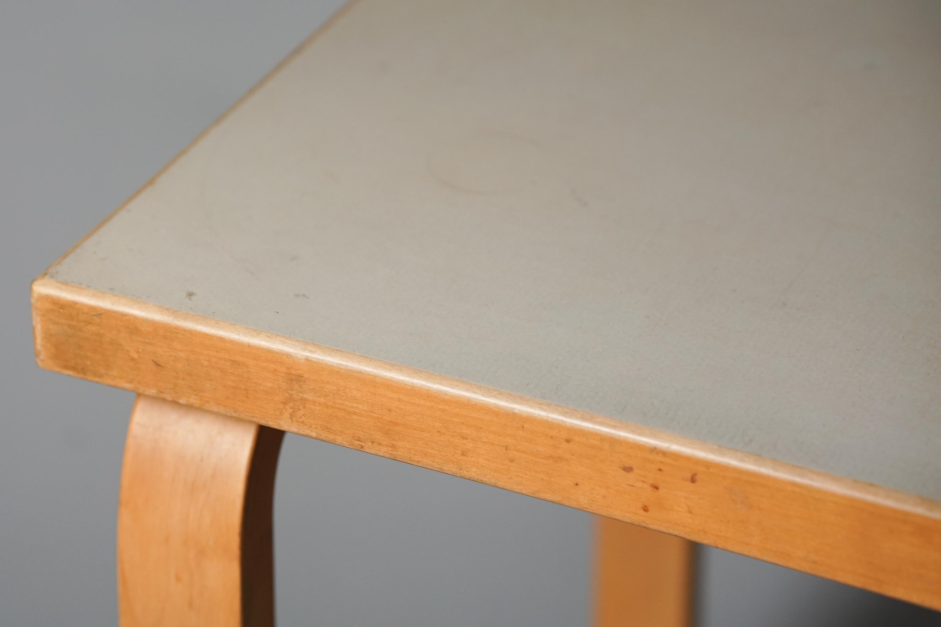 Table, designed by Alvar Aalto, manufactured by Oy Huonekalu- ja Rakennustyötehdas Ab, 1950s. Birch frame, linoleum table top. Good vintage condition, patina and minor wear consistent with age and use. 

Alvar Aalto (1898-1976) is probably the most