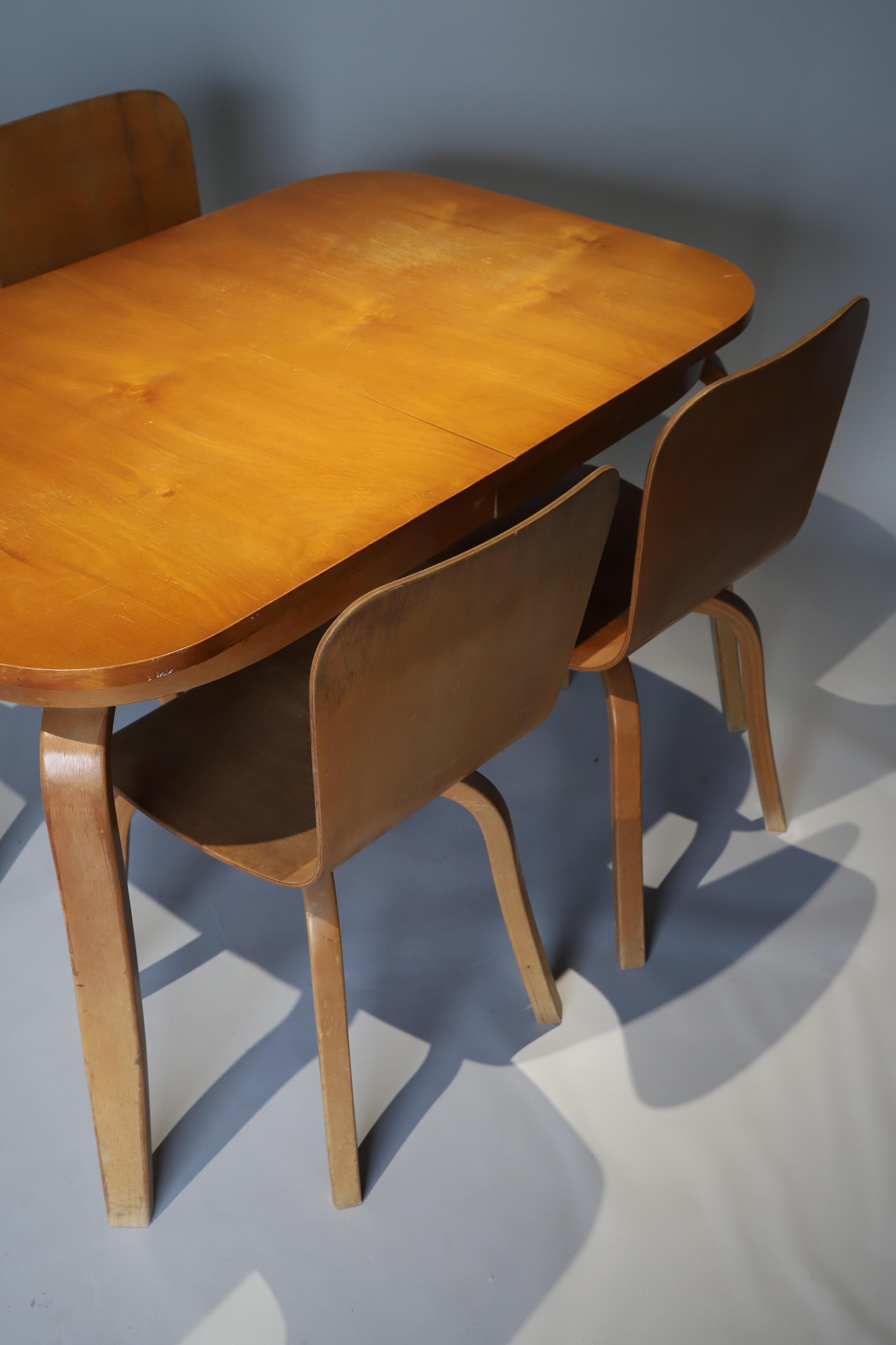 Wonderful bent wood table and chairs Waclaw Czerwinski and Hilary Tylolt for Canadian Wooden Aircraft. Table and four, plus one. Extra side chair looks to be refinished. Table and four in original condition with some repairs.