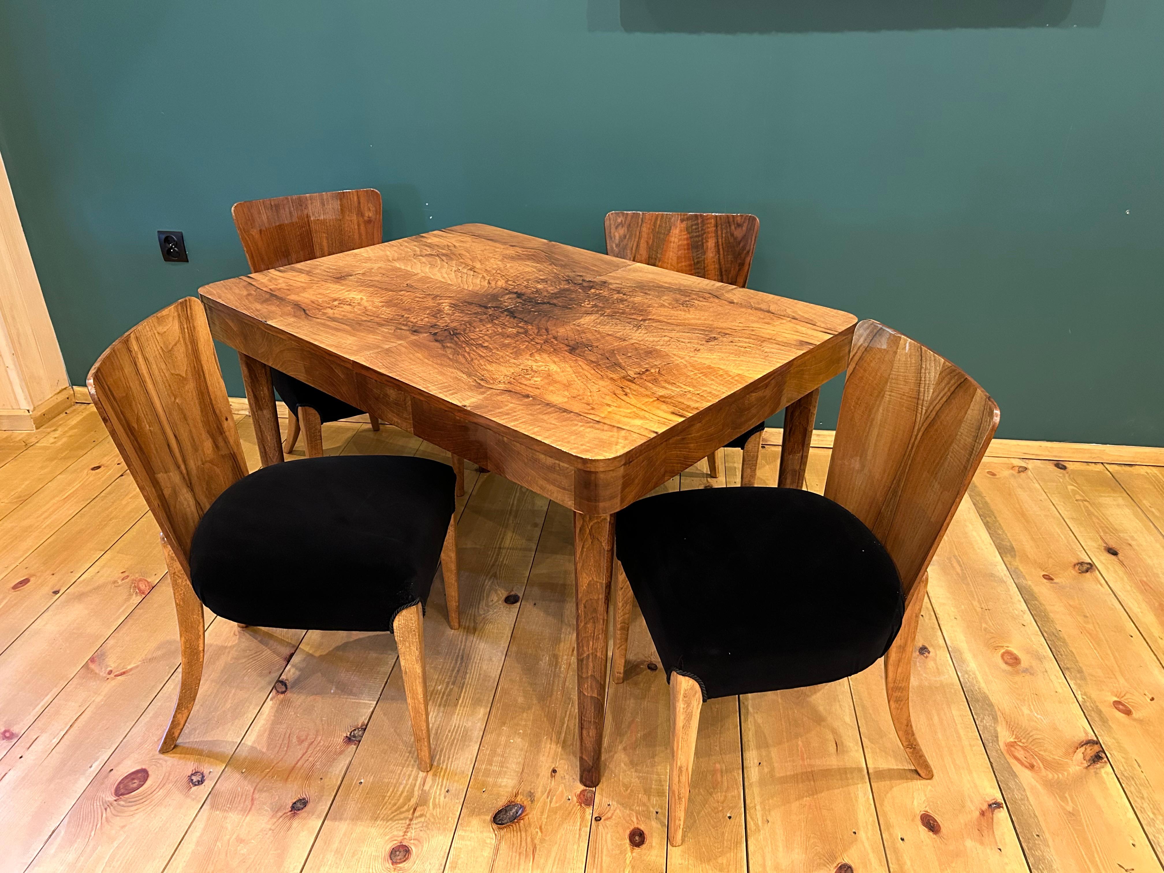 We present Art Deco dining furniture that includes a table and four chairs. A set from 1940, designed by a famous Czech designer
Jindrich Halabala, (a Czech designer ranked among the most outstanding creators of the modern period. The peak of his